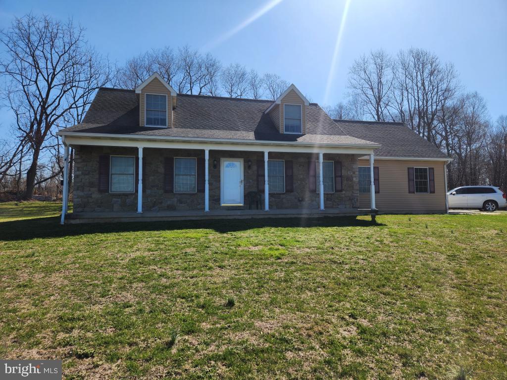 This property will be offered at Public Auction on Saturday, June 20, 2026 @ 12pm.  The listing price is the opening bid only and in no way reflects the final sale price.  10% down due at auction, 2% transfer tax to be paid by the purchaser, real estate taxes prorated. Set on 21 scenic acres, this beautiful property offers the perfect blend of privacy and convenience, located just off Route 272 with easy access to Quarryville and Lancaster. The first floor features a welcoming living room, a spacious kitchen and dining area ideal for gatherings, a convenient laundry room with half bath, a full bathroom, a primary bedroom, and an additional bedroom or office. Upstairs, you’ll find two additional bedrooms, one offering flexible space for storage, and a full bathroom, providing plenty of room for family or guests. The unfinished basement houses the home’s mechanical systems and offers potential for additional storage or future use. Outside, enjoy the peaceful setting with an oversized one-car garage, a pole barn for equipment or hobbies, and beautiful wooded acreage complete with a stream-perfect for those seeking space, nature, and tranquility. A perfect blend of land, location, and lifestyle ready for its next owner.