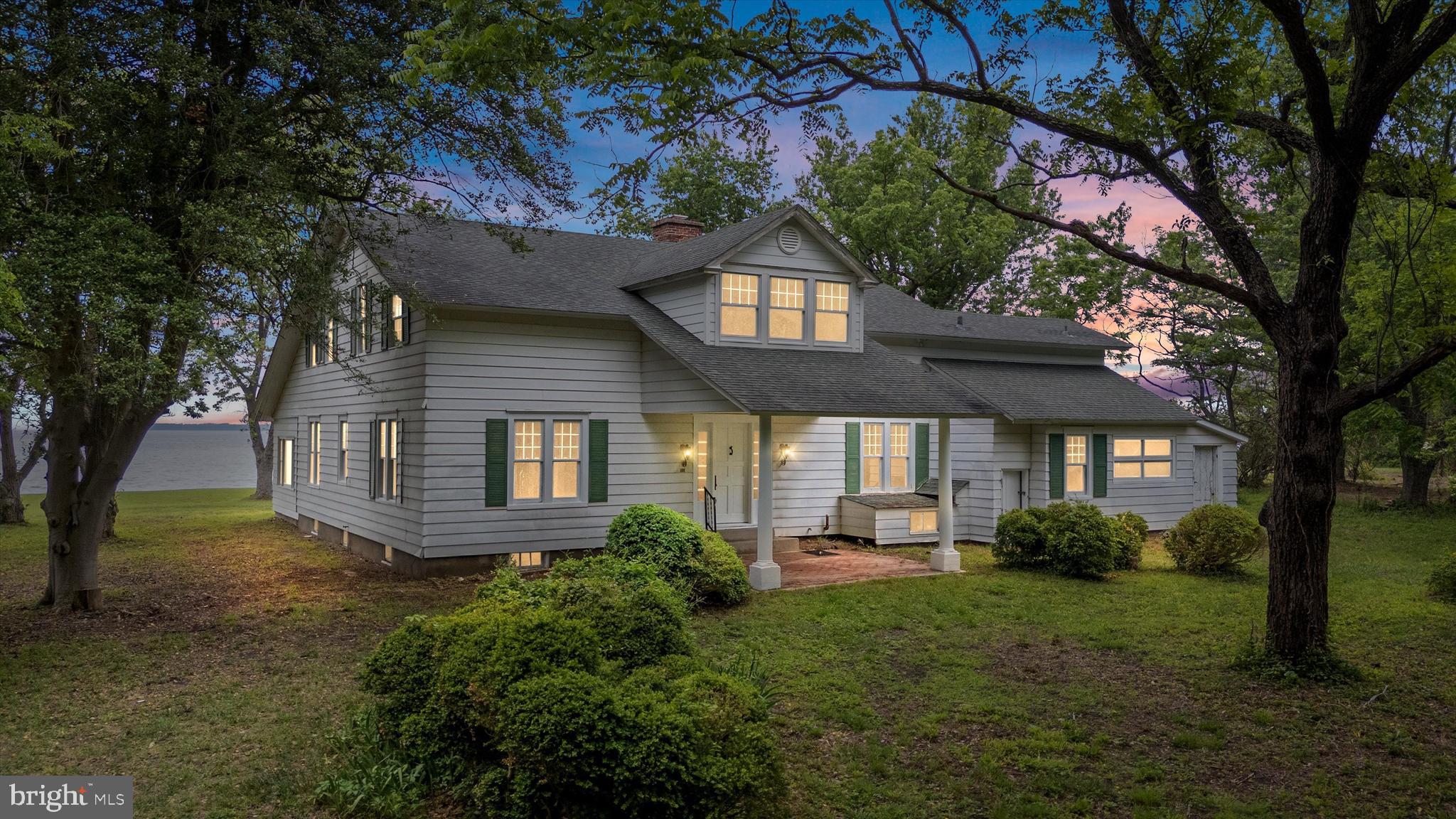 This is the quintessential Eastern Shore Waterfront Estate to turn into your legacy property. Sitting on over 12 acres just minutes from the Bay Bridge, this substantial craftsman built in 1914 once served as the primary residence for one of the lead engineers for the Pentagon, Jefferson Memorial, and other DC marvels due to its balance of proximity to the city and quality of life. Lifestyle amenities have improved since then with nationally renowned Queenstown Harbor Golf Resort and the marinas/dining options in Kent Narrows all minutes away. Privacy is paramount here with a wooded and gated entry lane but without sacrificing access due to the exit on Route 50 still less than a mile away. The sweeping views here are unmatched with the protected lands of Eastern Neck Wildlife Refuge across the Chester from the residence also guaranteeing this peace and tranquility for years to come. The home itself is a historic masterpiece with hardwood floors, hand blown glass windows, and grand center hall staircase. The connection with the water is celebrated here with multiple sunrooms boasting big water views for those special moments.  A rough cut timber 2 car garage and workshop provides old Eastern Shore charm. Wildlife here is abundant for the outdoorsman and nature lover due to it being one of the first large parcels after crossing through the hustle and bustle of Kent Island.  Invest wisely while improving your quality of life with your own waterfront sanctuary to create those special memories for generations.