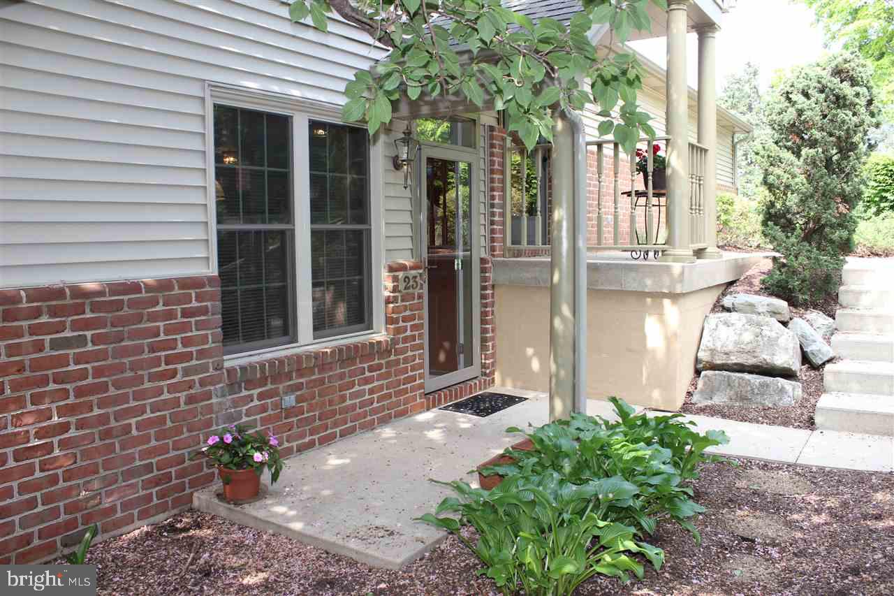 Popular Cambridge Commons 1st floor condo - CLEAN! --one floor living with large rooms, Hardwood Floors in LR, DR, Hall & MBR, custom paint, fireplace, screened-in porch with beautiful stone tile and porch closet, oversized one-car garage with extra storage, eat-in kitchen with island, .  All appliances stay.  New Pella windows in 2014. New roof in 2015.  In 2015 an annual roof assessment of $250 was initiated for a 6 year period.