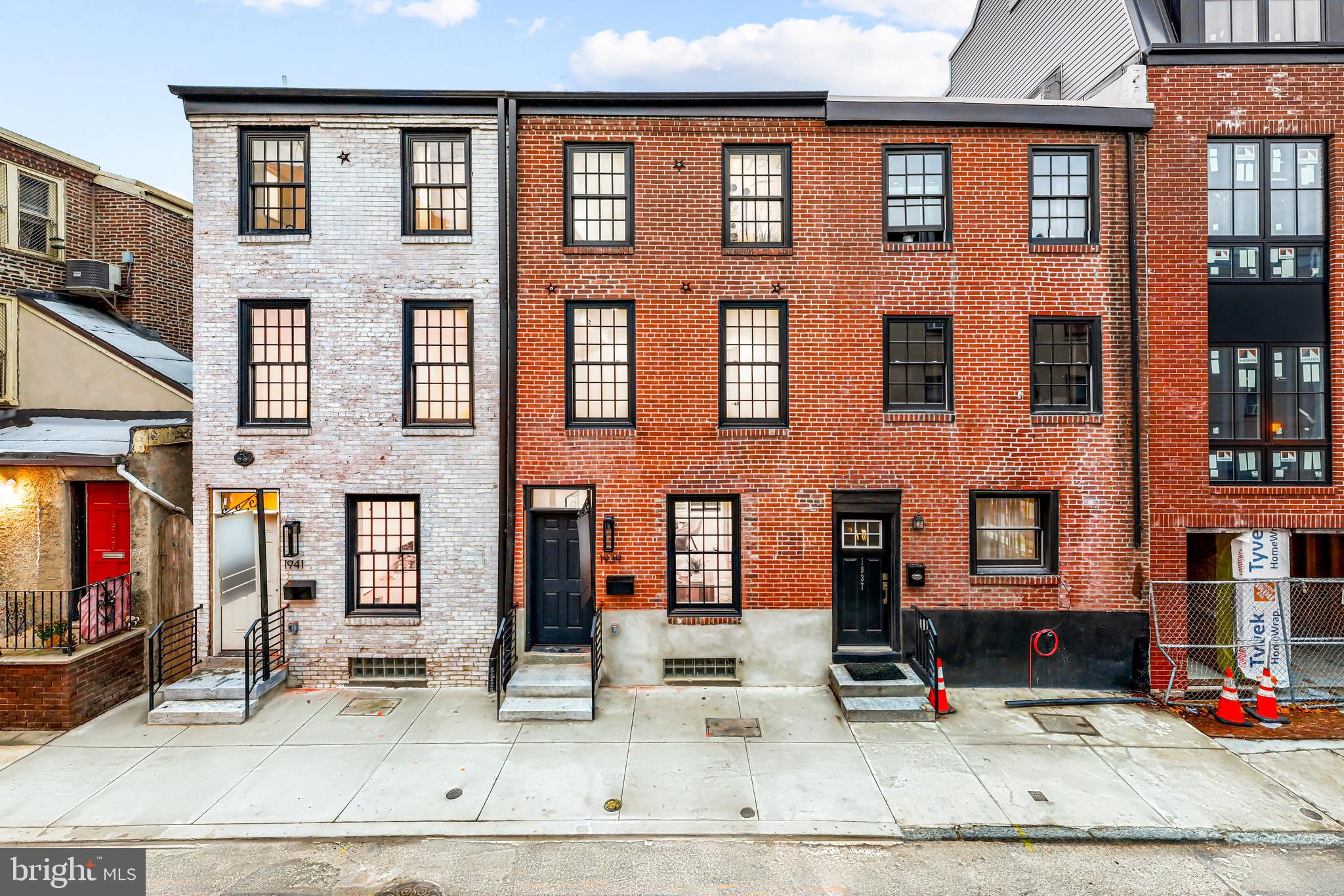 Introducing 1939 and 1941 Waverly Street. These two side-by-side luxury homes are nestled in the heart of Rittenhouse Square. Located on a quiet tree lined street just blocks from all the attractions the neighborhood has to offer--from fine dining to luxury retail and access to the city's most acclaimed parks. Blending designer finishes, contemporary design, soaring ceilings, and open spaces that seamlessly creates a perfectly balanced environment. Offering over 2,500 square feet of beautifully curated living areas, allowing for large-scale entertaining or intimate living. Enter into the open concept living space, complete with a  state-of-the-art kitchen featuring ample space, luxury appliances, and hand-selected finishes. Beyond, you will find a fully finished basement, four (4) generously sized bedrooms and four and a half (4.5) bathrooms providing plenty of space for guests or flexible living for any lifestyle. On the third level, you will find an oversized primary suite including a grand bathroom retreat with dual vanities and oversized walk-in shower. The sun soaked master bedroom leaves no detail untouched, from white oak tambour wall paneling, to expansive windows, and  a walk-in custom built in closet. Offering two (2) color palettes, refined for individual taste--these homes are complete with expansive layouts, ample outdoor space space, and high touch finishes--capturing the essence of urban luxury living. Lastly, 1 year prepaid parking included at a lot near by.