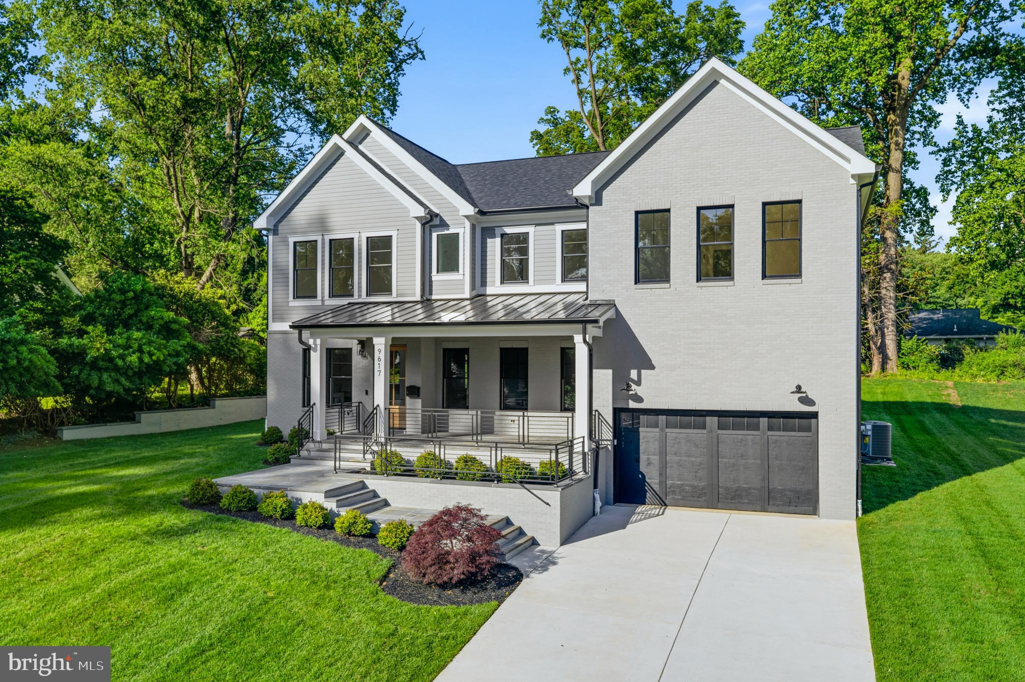 Exceptional new construction in the sought-after Rock Creek Hills community, just moments from the scenic trails, parkland, and natural beauty of Rock Creek Park. Offering over 6,100 square feet of thoughtfully designed living space, this high-end Craftsman-style residence blends timeless architecture, luxury finishes, and modern functionality. Featuring 6 bedrooms and 6 full plus 1 half baths, the home includes a rare main-level bedroom with en suite bath, ideal for guests, extended stays, or added flexibility.  The beautifully appointed interior showcases designer lighting, premium finishes, generous ceiling heights, and an open-concept floor plan designed for both everyday living and entertaining. A dedicated main-level office provides ideal work-from-home space, while the gourmet kitchen with premium appliance package opens to expansive living and dining areas and a covered rear deck for seamless indoor-outdoor living.  Upstairs, the luxurious primary suite offers ample walk-in closets and a spa-inspired bath, while additional bedrooms are generously sized with access to well-appointed baths. The finished lower level is an entertainer’s dream, complete with recreation space, wet bar, home gym, additional bedroom, full bath, and versatile bonus areas.  Additional highlights include a covered front porch, 2-car garage, exceptional craftsmanship, and quality construction throughout. Ideally located less than 1.5 miles to MARC Train, Forest Glen Metro, and downtown Kensington shops and dining. Under 5 miles to Pike & Rose, with convenient access to National Institutes of Health, Walter Reed National Military Medical Center, and commuter routes into Washington.