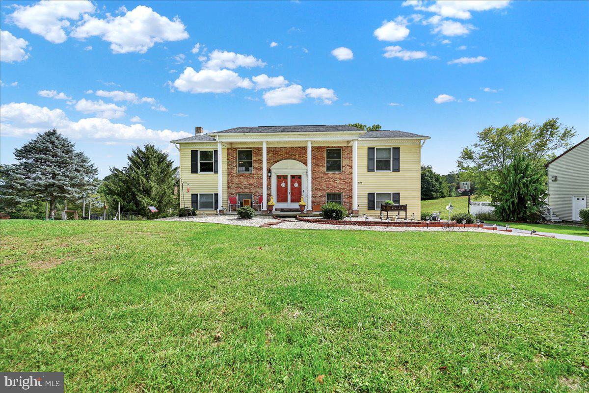 This updated 2296 approx. sq. ft.,  3-4 BR home is located on an acre lot overlooking the farm fields in South Hanover.  The bright and welcoming living room has newer Luxury Vinyl Plank flooring.  The kitchen/dining room has ceramic tile flooring, granite counters, an island with seating, and a pantry closet for extra storage.  The owners bedroom has mirrored closets and a private bath with a shower and tile flooring.  The main level also  includes 2 more bedrooms and a hall bath with a skylight.  Downstairs you'll find a family room with a gas fireplace, windows for natural light and Pergo laminate flooring.  In the rear of the home is another large room, currently being used as an exercise room with a patio door to the deck and a walk-in closet.  Down the hall, the office/Bedroom 4 also has windows for natural light and a large closet.  The laundry room has cabinetry for storage.  A side loading one car garage with opener completes the lower level.  Outside you will find the insulated and anti-humidity finished Man Cave/She Shed currently housing a gym.  The rubber horse stall mat flooring, a pellet stove for heat and a window a/c unit is included with the man cave.  3 more sheds are included for your storage needs.  The yard features a garden area and 3 Asian pear trees that entice the deer to visit from the farmer's fields.