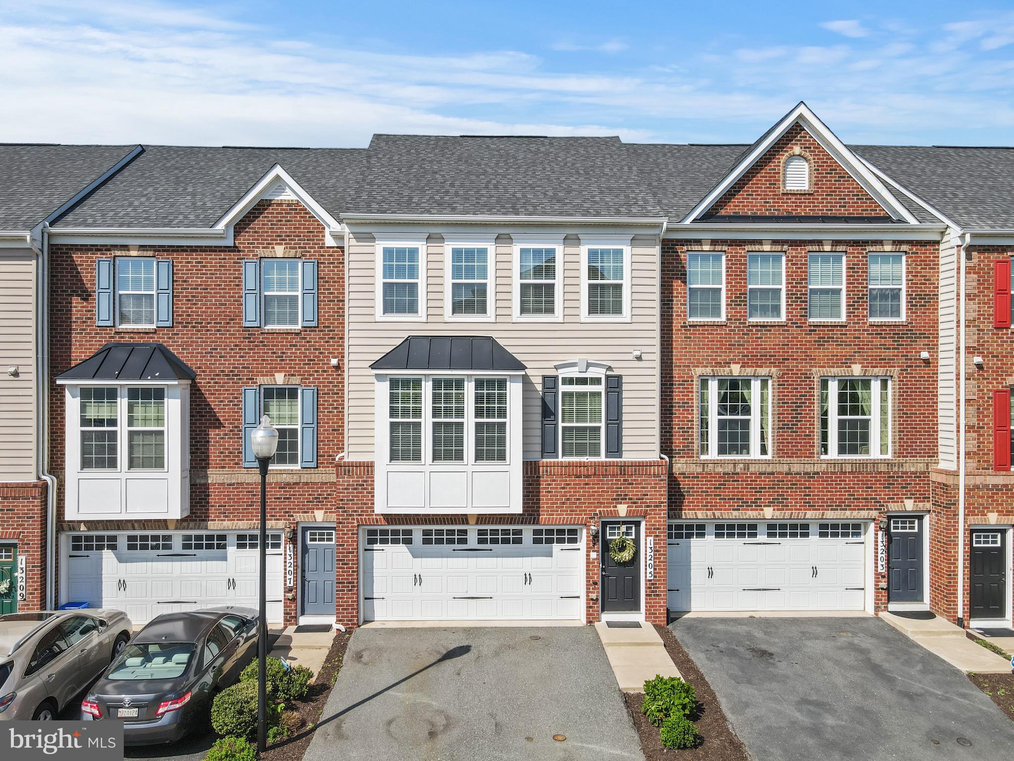 Don’t miss the 3D and video walkthrough tours! Welcome to this stunning South-facing 3-bedroom, 3.5-bath townhome that delivers the perfect blend of space, style, and convenience—designed for everyday living and entertaining! A 2-car garage in the FRONT of the house means you’ll have a fully-fenced, private backyard in the rear of the house! You’ll love the curb appeal with its classic brick and siding exterior, outdoor spaces that include a maintenance-free deck, a stone patio, and a backyard that backs to trees, offering privacy and peace of mind. Step inside to a bright and open layout spread across three finished levels. The main floor features a 9' x 2' bump out that adds extra space to the living room, wide-plank, hand-scraped solid hardwood floors, high ceilings, crown molding, and tons of natural light. The gourmet kitchen is a showstopper—complete with 42” cabinets, granite counters, stainless steel appliances, custom tile backsplash, a huge center island with seating, a separate breakfast bar and a built-in butler’s pantry with glass-front cabinets. All lower cabinets have convenient pull-out shelving! An entertainer’s paradise - there’s room for all your gatherings, whether it’s a cozy dinner or a crowd for the holidays. Upstairs, the spacious primary suite features a tray ceiling, walk-in closet, and a spa-like bath with dual vanities, a soaking tub, and a separate glass-enclosed shower. Two additional bedrooms, a stylish hall bath, and a walk-in laundry room with a utility sink round out the upper level. Downstairs, the walkout basement offers plenty of space to unwind—movie nights, game days, or just kicking back—with a third full bath and access to both the backyard and the garage.

But it’s not just what’s inside that makes this home special. You’re a short stroll to the MARC commuter train station—an absolute game-changer for an easy ride into DC. This walkable neighborhood also offers it’s own local pub and restaurants, walking trails for miles, an enclosed dog park, playgrounds, tot lots, and you’re within walking distance to the Germantown Town Center. Whether you’re grabbing coffee, dining out, or catching a show at the BlackRock Center for the Arts, it’s all right there. It’s a lifestyle that’s active, social, and super convenient. This one checks all the boxes—and then some. Don’t miss it!