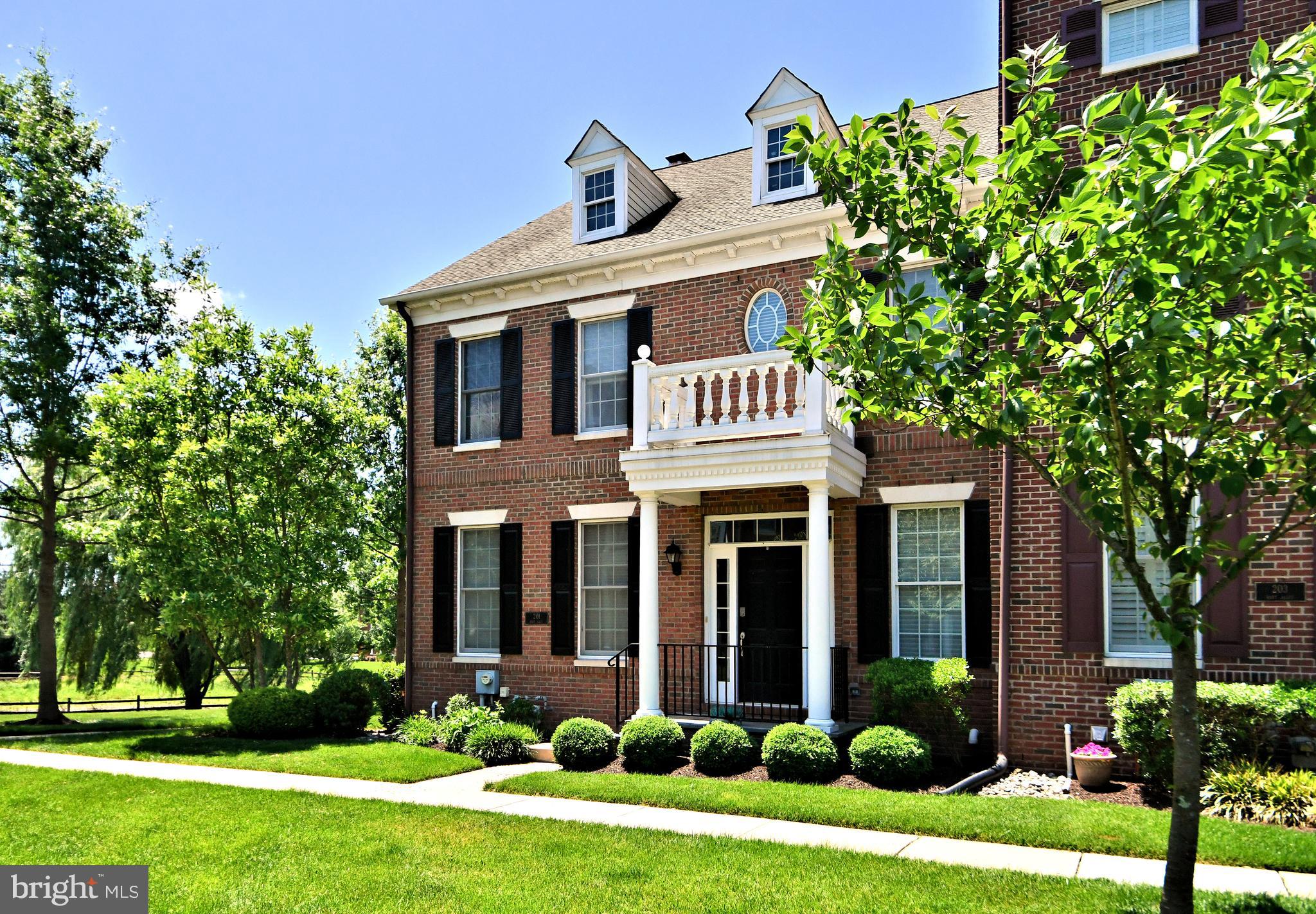 This beautiful end unit Carriage Home in Newtown Walk is impeccable throughout! Freshly painted and in move in condition! Enter to a hardwood foyer, formal living room and dining rooms, perfect for entertaining friends and family. As you continue, you enter the Gourmet Kitchen area with new upgraded countertops, sink and faucet which is located on a large island. Premium stainless steel appliances, wall oven, electric cooktop, wine chiller, new dishwasher and refrigerator. There is also a spacious breakfast area adjacent to the laundry room. Enjoy relaxing in the large and cozy family room with custom built ins, gas fireplace and walls of windows allowing for plenty of natural sunlight to filter in. Sliding glass door leads to custom decking, perfect for outdoor grilling. Above are 3 spacious bedrooms including the Primary Suite with vaulted ceilings, large walk in closets and luxurious bath with soaking tub! 2 Additional bedrooms are on this level and access a hall bath. Below is a full finished basement with plush carpeting, full bath, bedrooms #4 and large great room. There is additional storage space for mechanicals, HVAC, hot water heater and 2 sump pumps, one is a Hydro Static Electric sump pump, alarm system, cable and electrical panel.  Homeowners association is responsible for lawn care, snow removal, trash, common area maintenance and exterior building maintenance.  All this within walking distance to Newtown Boro to enjoy all the things the Boro has to offer!