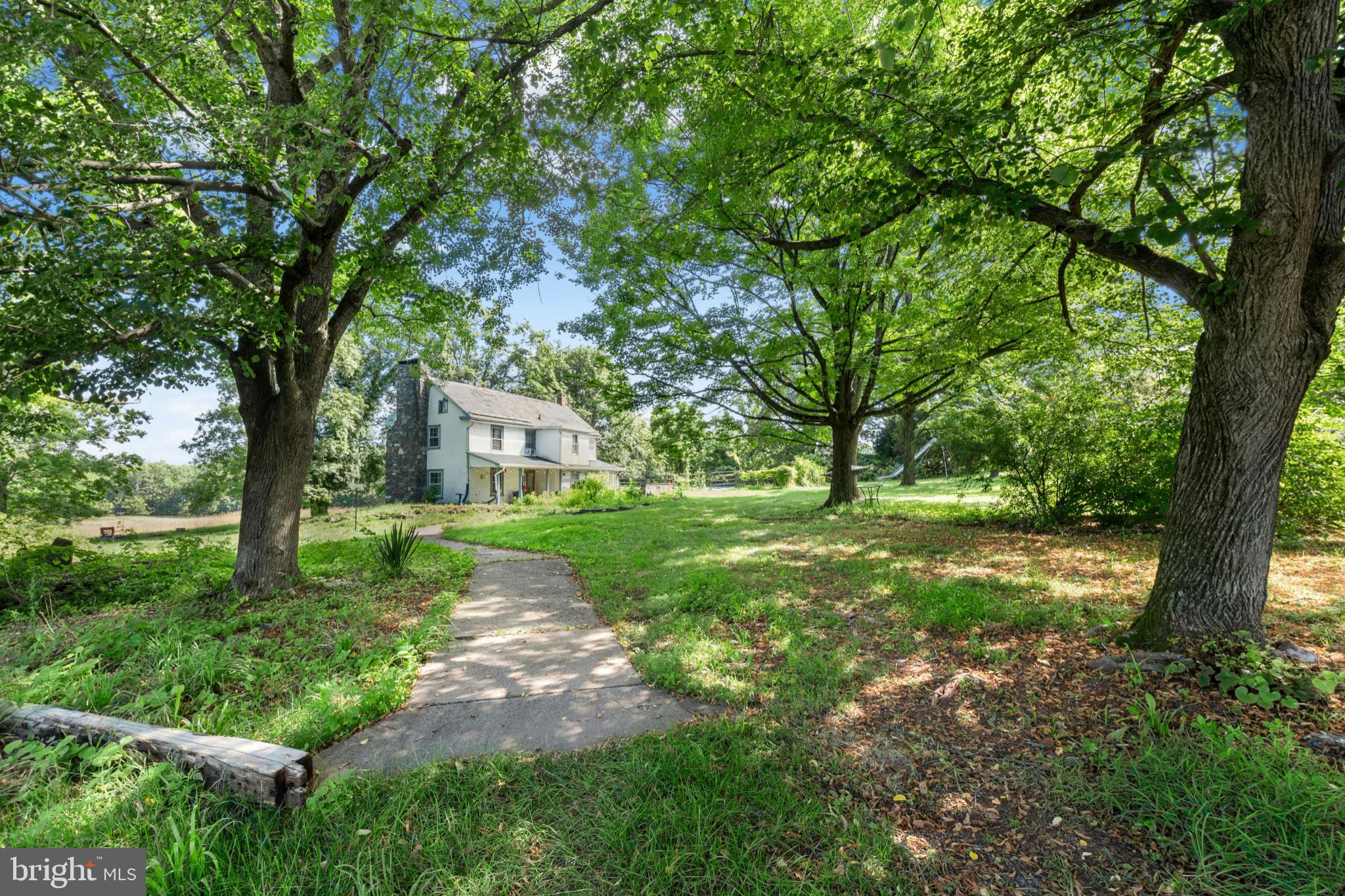 Set in the center of 87 acres amongst fertile rural lands in an area seemingly untouched by modern time, Cairnson Farm, is one of a few pristine unaltered Bucks County farms that still remain and is available for the first time in approximately 50 years. Own everything you overlook…rolling pastures and mature forest for exploring and watching wildlife. Here a collection of buildings will spark dreams and opportunities. A circa 1800s home with wood floors and beamed ceiling rests in a setting that warrants restoration and expansion or use this home as a guest house and build a modern masterpiece on the highest point with long distance views of the majestic Delaware River.
A large barn building, previously used as a brewery, offers a versatile space for housing collections, equipment, projects and workspace. With a 4 story lookout, massive beams framing high ceilings and open spaces, concrete floors, electric, lighting and full bath, the cost to replicate this building would be considerable.  An antique stone and frame bank barn is a classic piece of history and also offers room for equipment and collections. 
With no restrictions the acreage is a refuge and a delight, offering a showcase of views and a symphony of silence where everyday, every season, presents a new opportunity to enjoy the pleasure of an unspoiled oasis in the middle of an oft too civilized world.  Its country location is convenient to shopping, restaurants and entertainment and is the perfect weekend getaway from New York City and Philadelphia.  An adjacent home is available on 3 acres perfect for a caretaker, rental, or extended family.