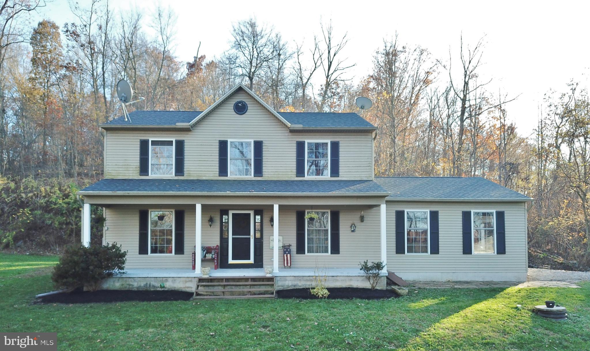 Privacy, location, and view!  Amazing opportunity to live minutes from the MD/PA line on over 4 acres in Shrewsbury Township.  This two story colonial is sitting on a hill overlooking southern York county countryside.  Inside, wonderful wood floors, lots of windows, and a great kitchen with granite countertops, lots of cabinets and SS appliances.  The lower level is partially finished for added room.  Also on the lower level is a fantastic storage area with lots of shelving.  Two car attached garage too!   Enjoy the exceptional view sitting on the front porch or relax on the private covered back deck.  This home comes with a one year home warranty.  Move in ready.  Check out all the pictures and make your appointment today!
