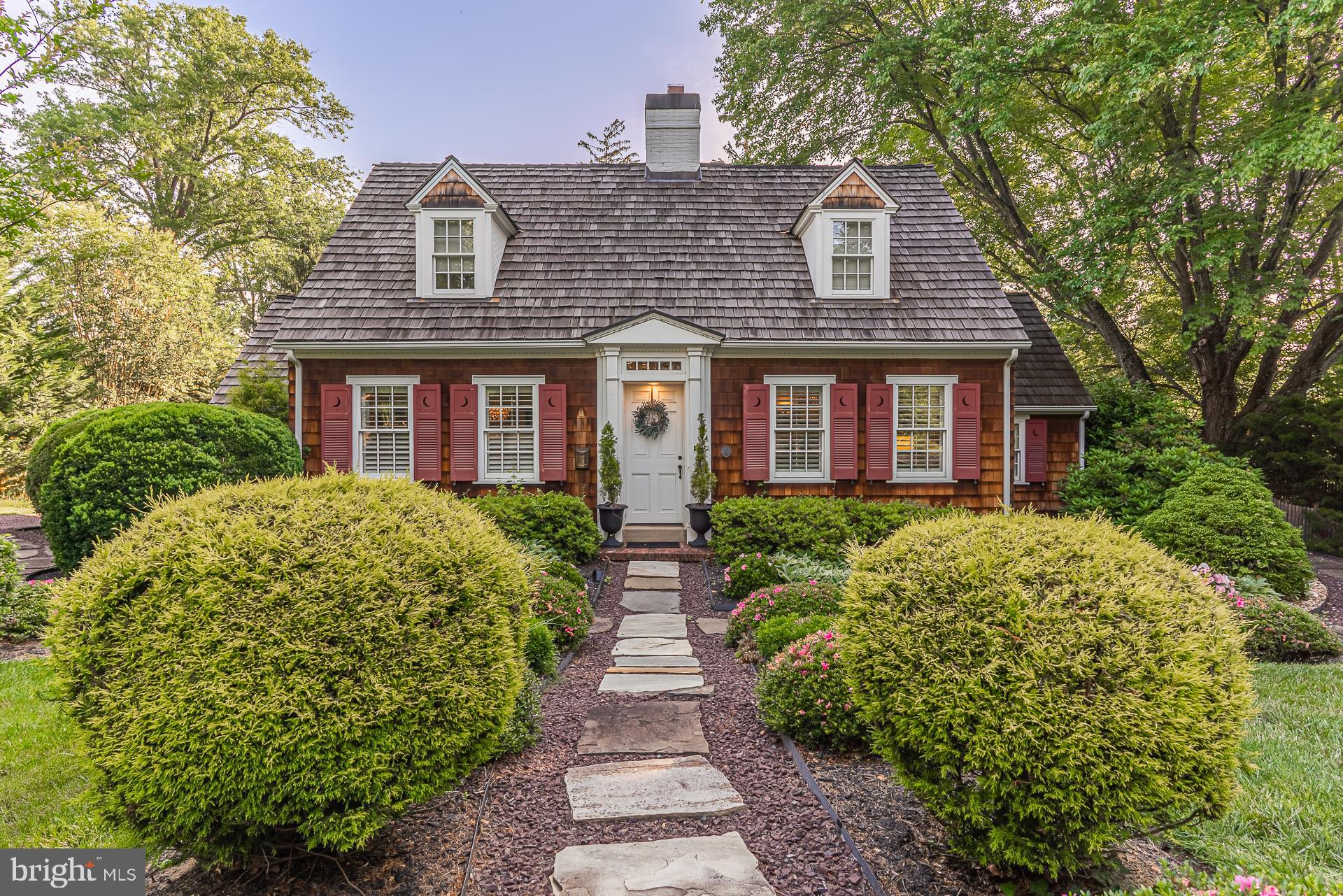 Welcome to the charm of Broadmont, a premier neighborhood of landscaped lots, and mature gardens that burst with color.  This half acre lot is the gem of Falls Church City! Light filled Master Bedroom with vaulted ceiling, palladian windows and a luxurious Master Bath with skylight. A bay window now brightens the kitchen. Custom solid cherry cabinets, wall ovens, a granite peninsula with bar seating that allows guests and family to gather in the kitchen. French doors open to the brick patio from the large living room for easy flow and entertaining. The back door enters into a small multi-purpose family room with a gas fireplace and plentiful custom cabinets. The second bedroom on the main level can double as a study or guest room and is connected to a full bath. Upstairs each bedroom has its own bathroom. There are also numerous hidden surprises throughout. The brick patio leads to a professionally landscaped backyard, with 'fairy garden.  The backyard is surrounded by fencing and a curved brick wall shields the view to the parking area. The location is superb - less than 1 mile to EFC Metro, W&OD Trail, shops, restaurants, and Whole Foods! Plus sought after City of FC schools make this property a real winner.
