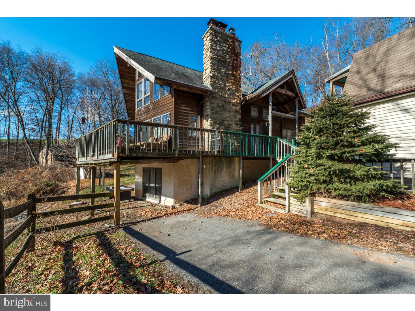 One of a kind private setting on 15 wooded acres overlooking Octorara Creek. Well built custom A-frame with detached 2 car garage, barn. Long driveway, wood shed.