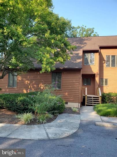 ENJOY the Peace & Tranquility with Views of the Golf Course & Woods from the main & upper level decks. This 3 bedroom, 3 bath Townhome offers a main level bedroom , main level full bath, freshly painted T/O ,  front porch, front door also  freshly painted,
new luxury vinyl plank flooring on the main level.  Upper Level consist of 2 spacious bedrooms & laundry -  washer &  dryer. Primary Bedroom has walk-in closet w additional closet,  balcony/ deck, primary bath w shower & jetted tub ,  additional storage / attic space  off Bedroom #2 & a 2nd  Full Bath.  Combo - Living /  Dining Area  has wood burning fireplace ,  updated faucets, newer heat pump, new roof. Current Owner will update dues & the pay  initiation fee  ( $3100.00 ) for the Purchaser to obtain the Sports Package B. If Golf Pkg is desired -   Current Owner will update the dues  & Purchaser will be responsible for Inition Fee $3100.00 .  Easy to Show & Ready for Immediate Occupancy -  Shopping & Schools within Minutes . Approx 15 Miles from I -81