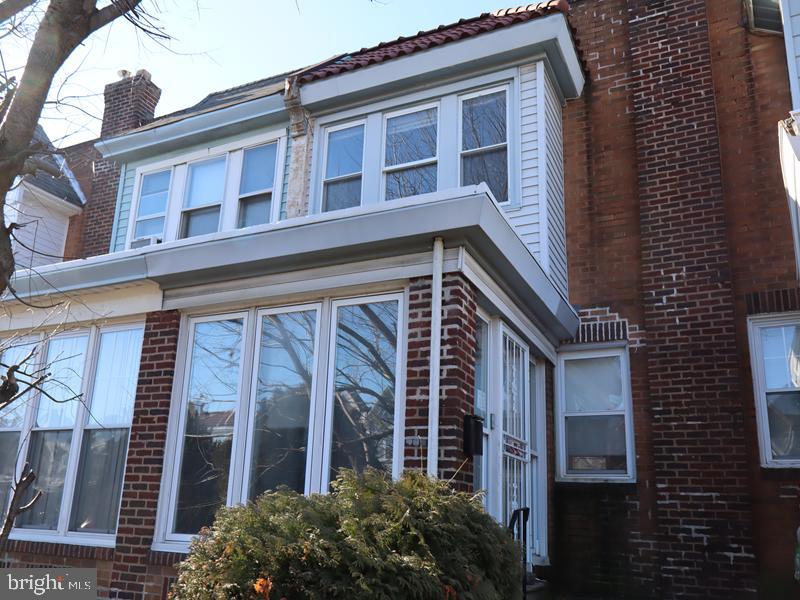 Great two-story brick row home located in the desirable West Oak Lane section of Northwest Philadelphia. Built in 1925, this property features an enclosed front porch, a spacious living room, formal dining room, and a kitchen with pantry access. The second floor offers three bedrooms and a three-piece hall bath. Additional highlights include an unfinished basement, rear garage, and driveway parking. Conveniently located near the Montgomery County line with easy access to shopping centers, a local mall, and major highways.