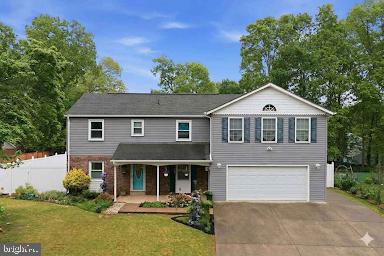 Updated AND expanded colonial offers four spacious bedrooms, including dual primary suites!  This unique configuration was designed and would be perfect for multi-generational living and boasts TWO primary suites, with even an additional "living" area on the second floor, complete with wet bar!  Lovely kitchen w/ dual pantries & custom hickory cabinetry - Oversized garage w/ shop space - Sun room overlooking the patio & privacy fenced backyard -  Easy care Bedroom level hardwood flooring - Three fireplaces - Cul-de-sac setting with mature trees - Convenient location minutes to 234, 66 & Prince William Parkway!