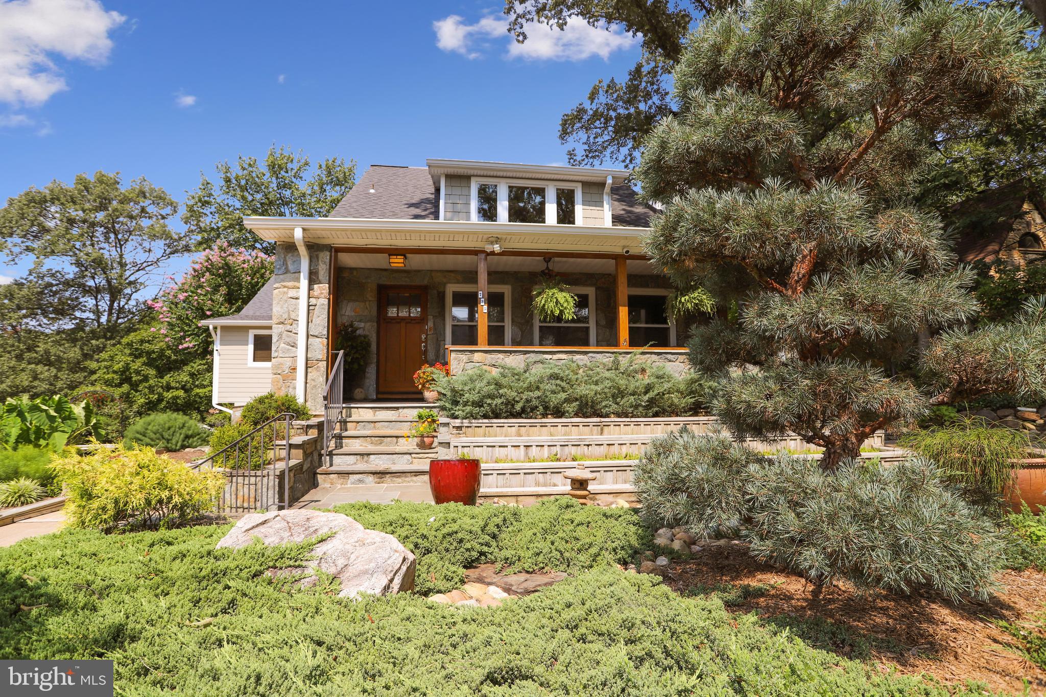 Motivated Sellers are moving south! Terrific location in the established Braddock Heights neighborhood. The pictures don't do this home justice. Come see it in person and fall in love. Welcome home to this incredibly comfortable masterpiece. From the covered front porch to the suspended concrete patio off the family room, this feels like a vacation. The main level includes a charming living room with wood-burning fireplace; separate formal dining room; and an incredible kitchen that opens to a generous family room with gas fireplace and a second dining area - perfect for family gatherings and entertaining. The kitchen is a chef's delight - enjoy the ability to be at the party while cooking. Attractive custom alder wood cabinets; six slide-out, self-closing pantry shelves; custom Silestone countertops; oversized island; two sinks; five-burner gas cooktop; warming drawer and a beautiful custom designed elm slab natural edge breakfast bar. The five bedrooms, five and a half baths include two master bedroom suites. The main level Suite has an oversized walk-in closet with built-in shelving, cabinets, and a stackable washer and dryer. Wake up to a treehouse setting overlooking the lovely rear yard in the upper level Master Suite which has an incredible bath, walk-in closet + a second closet and built-in desk (plenty of room to add an office). Two additional bedrooms are on the third floor, each with its own bath. A separate laundry room with large washer and dryer completes the third floor. The lower level offers a sizable bedroom and full bath, large recreation room; a playroom currently set up as a putting room for the family golfers, and two separate storage rooms with shelving. The stunning, oversized, custom-designed wood-framed windows bring the outdoors inside. The staircases are white oak with open railing, and the interior doors are solid core six-panel. The heating and cooling is a 3 zone Carrier Infinity HVAC, and the storage room and garage shelving is commercial grade. The extra-large gas fireplace in the main floor family room heats both the main and second floors. Garage and two driveways. House has easy access to Timber Branch Parkway walking trail. The owners were recipients of the Alexandria Beautification Commission Awards for homes that meld the garden and the house in a manner that is both extremely interesting and unique. Copy and paste in your browser to view photos and floor plans:  https://tour.TruPlace.com/property/139/90630/