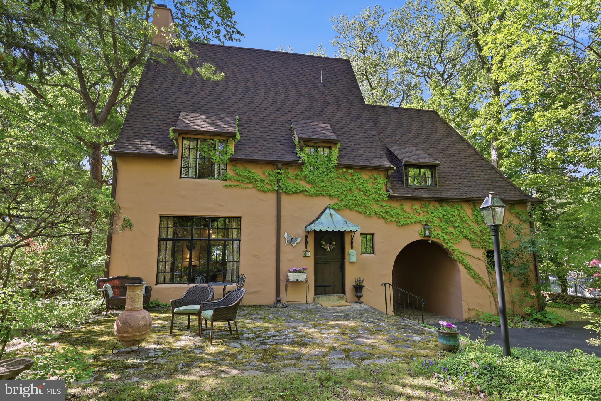 You have a very rare opportunity to own this GORGEOUS FRENCH CHATEAU in Bucks County!!!
This Norman French Chateau was built by an architect in 1928 for his own family. You will have the honor of being only the 4th owners of this home that comes with so much history and charm and the original blueprints! The current owners purchased the home in 2014 and fell in love with the European charm and saw its potential. Staying within the old style, they updated the home by replacing the oil heat with natural gas and brand new top of the line Knight gas furnace in 2014. The house is heated by natural gas radiators, baseboard heat and Mitsubishi ductless remote controlled mini split units that also serve to efficiently cool the house.
The ergonomically appointed kitchen was completely remodeled with all Quaker handmade cabinetry, extra deep, lighted cabinets, soft closed drawers, stainless steel GE appliances, a 1.5 gas oven range, Italian tile work and backsplash, quartzite marble countertops [lifetime warranty], a Koehler farmhouse sink and wooden breakfast bar with barstools.
A custom built in wall cubby gives ample room for storing shoes, hanging your jackets, keys with built in storage above when entering through the covered carriage archway.
Brand new roof was added in 2023 along with all copper guttering. Newly paved 150 ft driveway in 2024.
 The jack and jill bath upstairs had a complete remodel in 2015. The house has original fir wood floors refinished 2015. New tile added to upstairs bathrooms in 2015. Interior and exterior of home was painted in 2015.
Over the one car garage boasts an impressive studio with huge built in skylight and 18 foot ceiling with gorgeous wood beams and paned windows. Above the house is a third floor PLUS an attic that has a huge amount of storage.
The basement contains the washer and dryer and workbench and plenty of room for ping pong table, game room, man cave or home gym.
Come see this charming 3 bedroom, 2.5 bath chateau with beautiful front dutch door with original copper awning, carriage archway, original hardwood beams in living area downstairs, handsome wood burning fireplace, original waterwheel cut baseboards throughout, original rough hewn doors throughout, door fixtures and hinges that were originally forged by a local iron smith, original dry stacked rock wall around backyard, mature trees, plenty of rhododendrons in front providing abundant privacy to the front stone terrace, rear deck is equipped for a 2 person hot tub. Plenty of wildlife will greet you here.
Located in highly desirable Pennsbury School District, Yardley’s very sought after neighborhood of Arborlea, close to train station, 90 minutes from NYC, close to I95, Route 1, and only 30 miles to downtown Philadelphia.