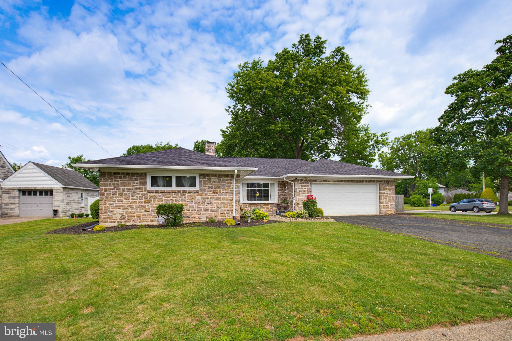 This charming ranch-style home, built in 1955, offers a perfect blend of comfort and functionality. Featuring a new roof installed in 2024 and new gutters added in 2025, this property offers excellent peace of mind. With 1,410 square feet of thoughtfully designed living space, this residence features three cozy bedrooms and one and a half bathrooms, ideal for both relaxation and daily routines. The inviting eat-in kitchen is equipped with modern appliances, including a built-in microwave, dishwasher, electric oven/range, and refrigerator, making meal preparation a delight. Step into the spacious living area, where two wood-burning fireplaces create a warm ambiance, perfect for gatherings or quiet evenings at home. The partially finished basement provides additional space for a home office, playroom, or storage, while the laundry area is conveniently located for ease of use. Outside, the expansive 0.32-acre lot features a lovely patio, perfect for enjoying morning coffee or evening barbecues. The attached garage and ample driveway parking ensure convenience for you and your guests. Located in a vibrant community, this home is just a short distance from local parks, providing ample opportunities for outdoor activities and relaxation. The neighborhood boasts excellent public services and is in proximity to well-regarded schools, making it a wonderful place to settle down. Experience the warmth and charm of this delightful home, where comfort meets community.