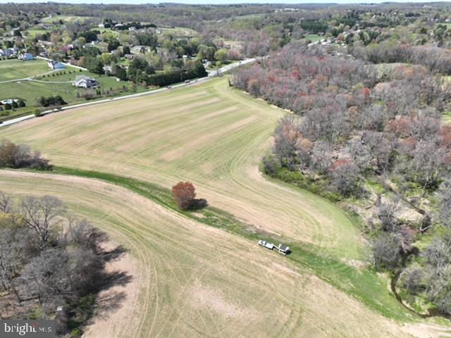 Welcome to Carroll County, and your very own slice of heaven! The beautiful 83 acre farm located in Sykesville is known for it's quality soils, and endless views. Situated on RT. 97 and Obrecht Road, you'll have quick convenient access to Sykesville, Westminster, Howard County, Mount Airy, and Interstate 70. The farm has approximately 60 tillable acres with a farming lease that renews after the fall harvest. The farm is comprised of two parcels, one agricultural parcel, and one conservation parcel. The middle of the farm is where the conservation piece is situated.  it is wooded with a stream running through it.  This conservation parcel has 7 building rights, that cannot be used on this parcel due to the flood plain, but per Carroll County Development Review, those 7 building rights can be transferred to the Agricultural parcel to be used as desired. Included with the farm is one single family dwelling, and one trailer home, both sharing an existing well and septic. Each dwelling is rented, and the rental rates can be provided. With the existing house, the county has stated that maximum development potential on this property would be the 7 lots plus the reminder. No other percs or wells on the farm, but discussions with Carroll County Health Department were encouraging that obtaining another perc is favorable on the property. This is the perfect farm for a home estate, equine facility, farm, or just keep it all tillable, and enjoy the wildlife that is abundant in the area. Come take a look, and let the sunset steal your imagination.
