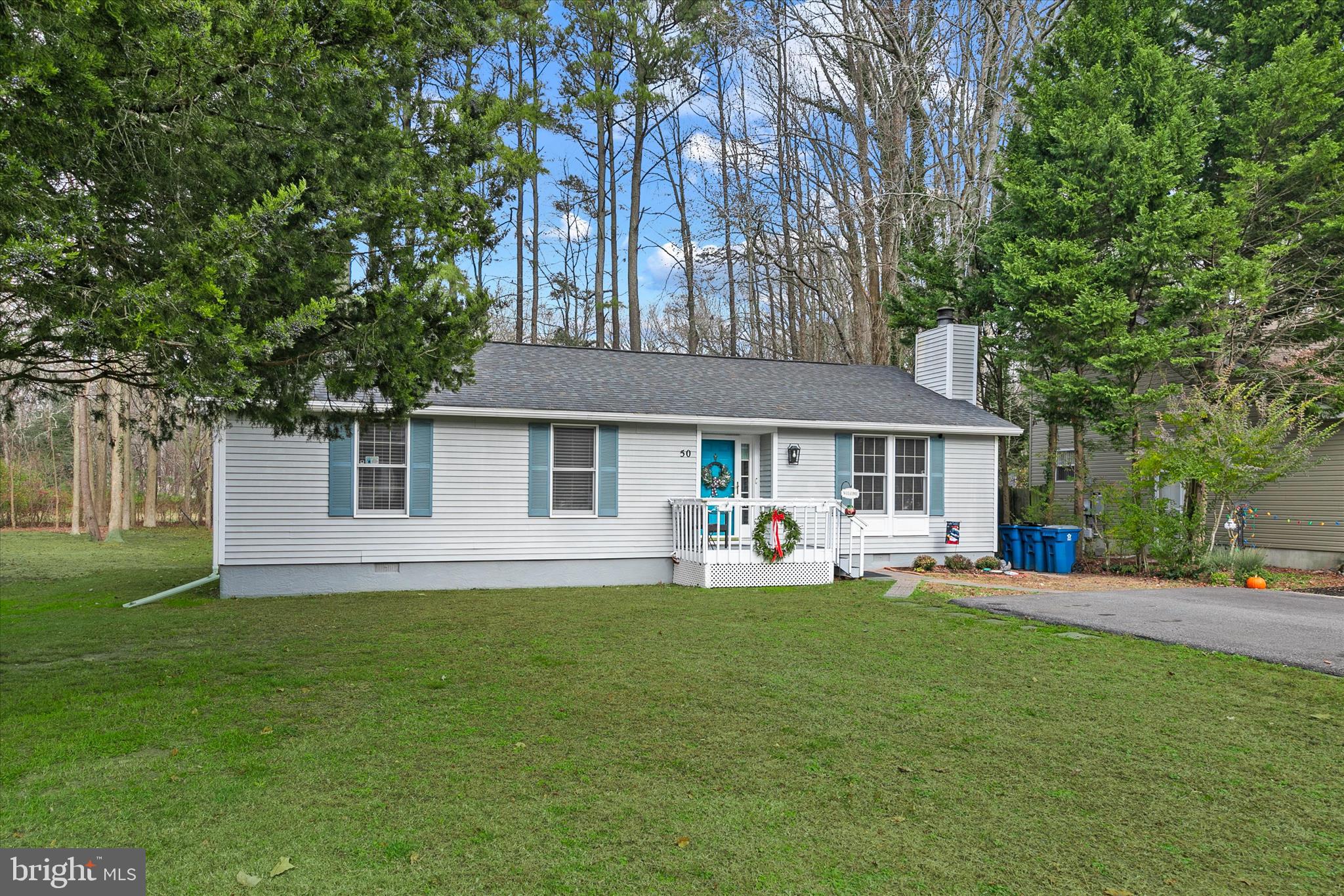 New price and newer look .Expanded 600 sq. ft .  addition brings the total finished square footage to 1944 estimated .Impeccable Ocean Pines Rambler with 3 /  4 possible bedrooms  and 3 full baths .There are Brazilian hardwood floors main living area and they look great. The roof was replaced in 2018  and adds to the fine Curb Appeal. There is also a living room wood burning  brick fireplace ..Freshly painted and lots of windows .This fine property shows very well. Large  table space eat-in  kitchen with recessed lighting  .There is a hot water heater for the main house and a second hot water heater for the addition. The addition has electric baseboard heat and a single window unit a/c. The 4th bedroom could also be used for a family room / office /or in law suite. Main house and addition has encapsulated crawl space. Great lot backing to green space sits on a lightly traveled no thru street. There is a large shed in the backyard. Great community with lots of amenities. There are 5 pools , marina , golf course with memberships are available and you can join the beach club  with ocean front parking another pool and bath/shower house  . Natural Gas is run to this fine home.