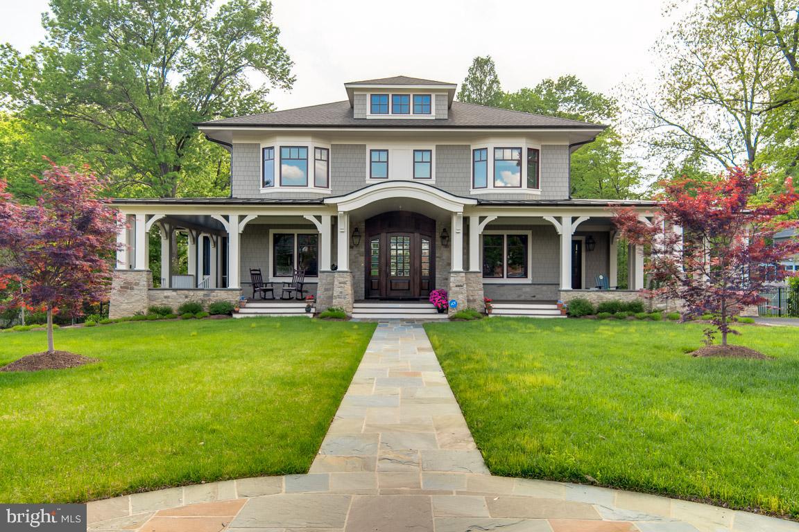 Price Adjustment!!  Falls Church living at it's best in a Custom Craftsman Style home built by Prestigious DC's Custom Builder of the Year, Thorsen Construction and Designed by Award Winning McNeill Baker Design Architects.  A Wrap around porch with Trex decking  leads to the inviting Brazilian Mahogany front door. Drive through the Grand Portico to Detached 2 car garage.  Inside: 6500 Sq Ft, 6 bdrms, 5.5 baths, 10 ft ceilings, custom hardwoods & wainscoting throughout, kitchen w/ mahogany butcher block island, Sub Zero fridge, Wolf double ovens and Six Burner Stove, additional pantry in oversized mud room/laundry w/quartz center island. Living & dining rm with stone front fireplace, built ins, plus doors to outside rear upper deck & screened porch, overlooking .66 acres.  Flex rm/sitting rm/ in law suite has separate entrance & private bath. Office space on main level. Upstairs: Master Bdrm with his and hers walk in closet. Master bath with sep tub  & steam shower, towel warmer & built in cabinet. All Bdrms w/private baths. 4th floor has option reading rm/bedrm. Lower level:  wet bar, brick tile heated floor, au pair suite/ guest rm, custom built ins, home gym w/custom floor, lead to covered stone patio w/farmhouse ceiling fan. Screen porch w/stone front w/custom mantle. Detached two car garage with extra storage .  Builder warranty. Easy access to DC, Arlington, and Tysons! Walk to metro!