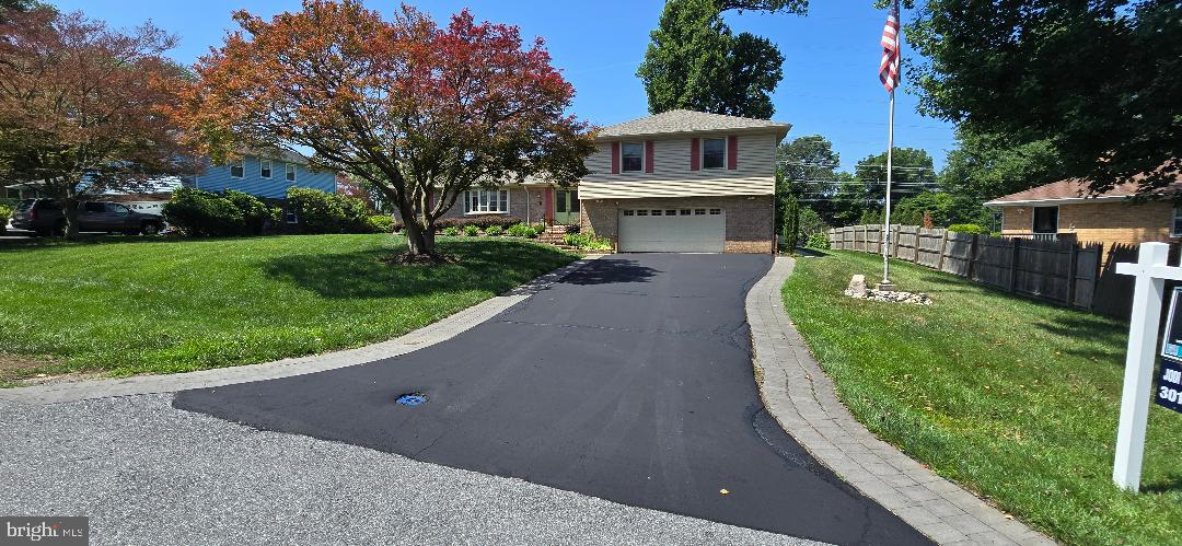 Welcome to this beautiful home, where the sellers’ pride of ownership shines throughout. This spacious property features 4 generously sized bedrooms and 3.5 bathrooms in the main home, plus a separate in-law suite complete with an additional large bedroom and a handicap-accessible full bath. The area on the floor plan is noted as a Storage area, and it is finished and can be used as an office/gym/craft room. The tax records reflect lower area as unfinished, but it is finished and has a rec room/bar area and an full apartment/in law suite. Recent updates include a new roof and a hot water heater that is only three years old. As you enter, you are greeted by a large foyer with two coat closets for added convenience. The kitchen is a standout feature, offering beautiful custom cabinetry with unique pull-out storage solutions, granite countertops, newer stainless steel appliances, and hardwood flooring that extends throughout most of the home. The attic is very a large storage area with lighting and easily accessible stairs.
The main level offers comfortable and functional living spaces, including a family room with a gas fireplace, main-level laundry, an eat-in kitchen, and a separate formal dining room. Upstairs, you’ll find four spacious bedrooms, including an impressive owner’s suite featuring a wall-length mirrored closet and a large private full bath.
The lower level is perfect for entertaining, complete with a full wet bar and full bathroom. Step outside to your own private oasis featuring a screened-in porch, hot tub, large pond with pump, and a stamped concrete patio with custom curved steps leading to the side kitchen entrance. A charming wooden plank walkway on the opposite side of the home leads to the front yard. Additional exterior features include two separate sheds, both equipped with power and lighting. The garage is truly a mechanic’s dream, offering abundant storage for tools and equipment, a laundry tub, and two kegerators plus a compressor that will convey with the property. Professional photos coming soon.