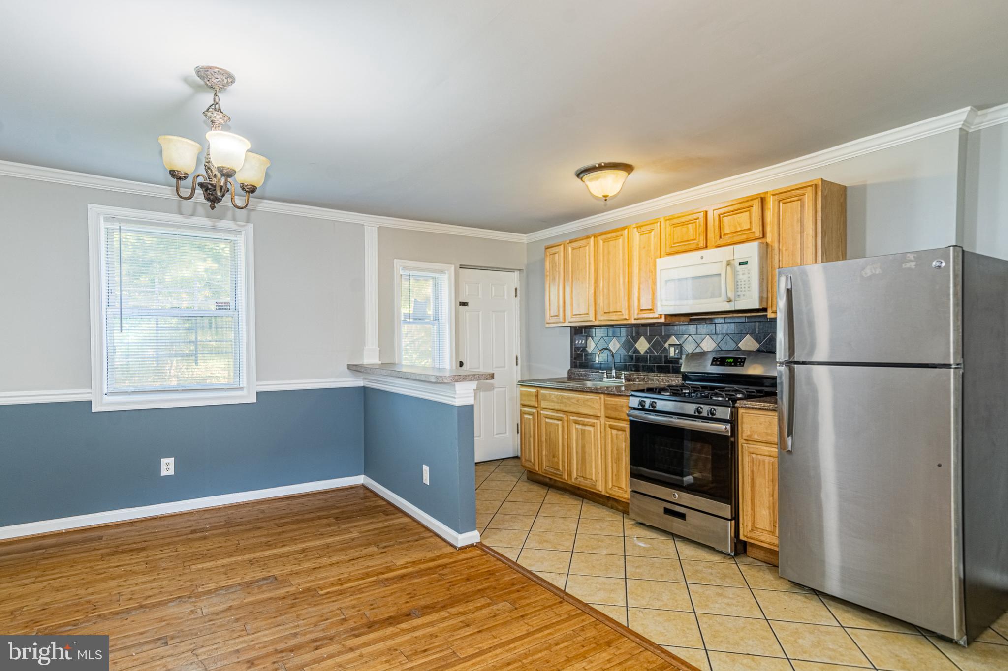 MOVE IN READY ROWHOME WITH 3 FINISHED LEVELS!  Features include hardwood floors throughout the main level, a spacious living room and separate dining area with crown molding and chair rail, and a galley kitchen.  The upper level offers 3 bedrooms and 1 full bath and the basement is fully finished with a large family room, half bath, and laundry area.  Convenient to Sinai Hospital, 83, and downtown Baltimore!