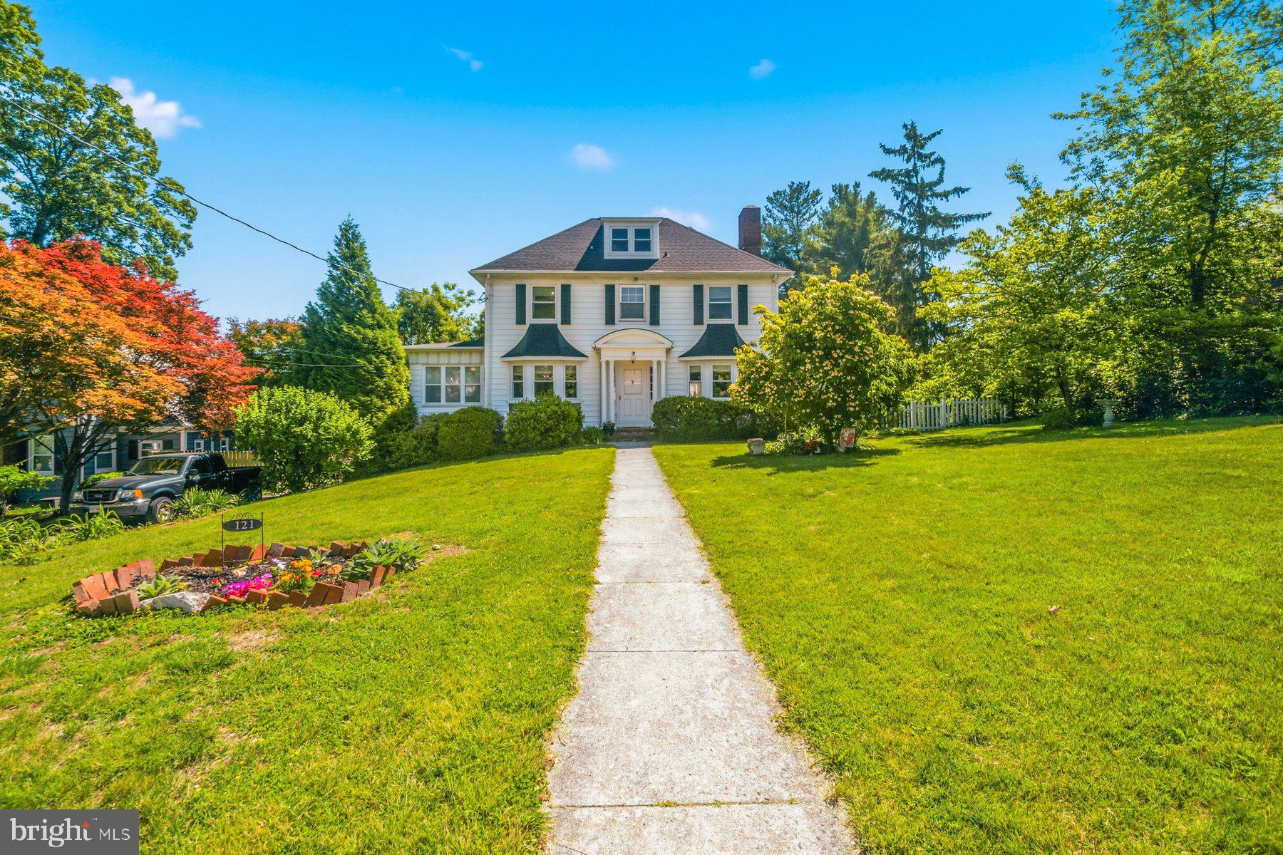 Welcome to 121 Forest Ave tucked away on a secluded, tree lined rd. This beautifully maintained 5 bedroom 2 full & 2 half bath colonial offer the perfect blend of privacy, comfort and timeless charm. From the moment you walk arrive you'll appreciate the inviting curb appeal, welcoming porch and peaceful setting. Inside the home features spacious living area accented by hardwood floors and abundant natural light. The updated kitchen is designed for both everyday living and entertaining offering modern finishes and ample space for gatherings. A bright and airy sunroom provides the perfect retreat to relax year round. Step outside to enjoy the expansive deck and in ground pool ideal for summer entertaining family fun or simply unwinding in your own private setting. Surrounded by mature trees and set in a tranquil setting this home combines timeless colonial style with today's most desired amenities. Major updates include central a/c 2020, new roof and water heater 2025 and new deck and paint in 2026.