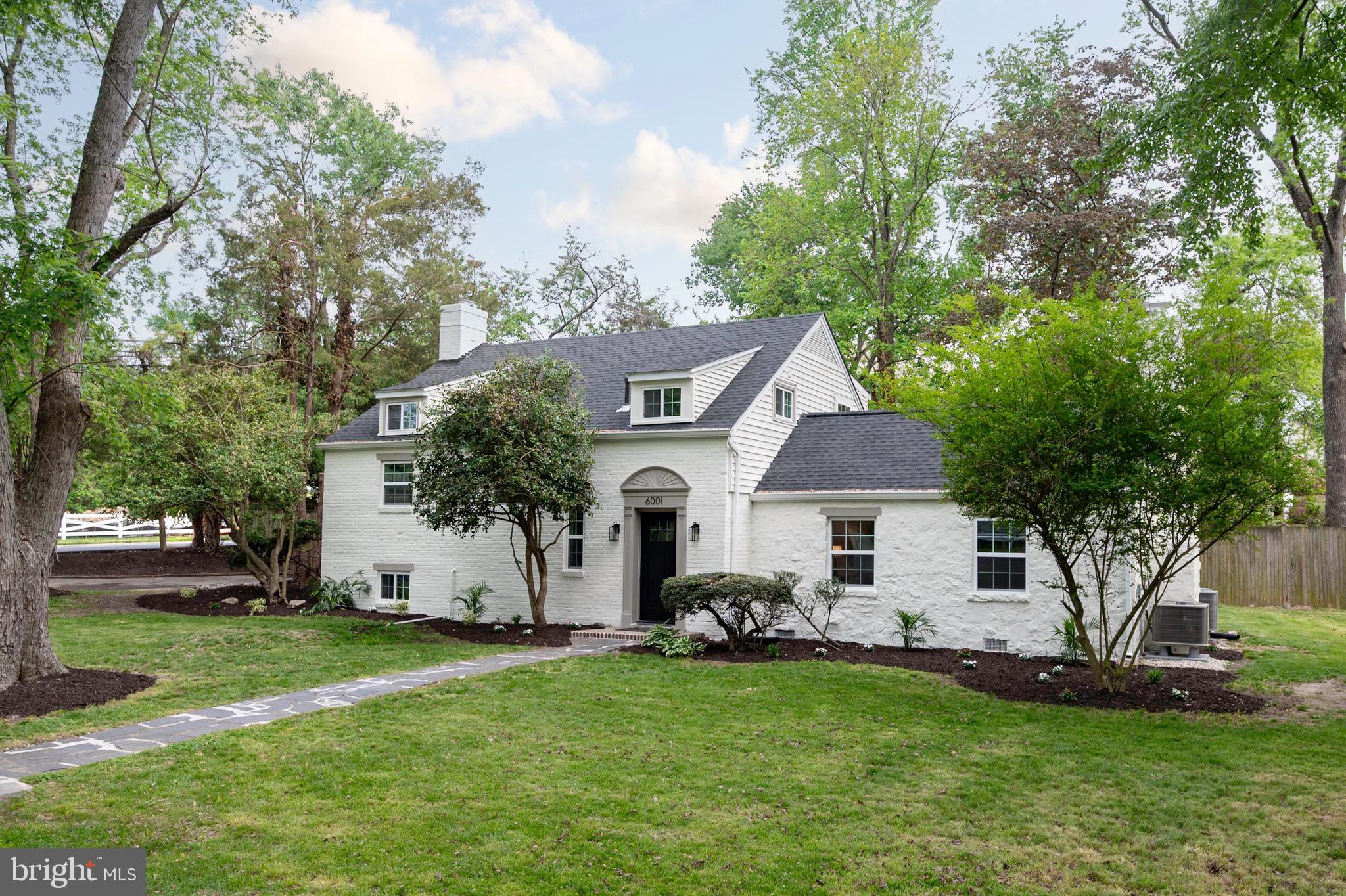 This beautifully updated home in the sought-after Wilton Woods neighborhood effortlessly blends modern amenities with timeless charm. Upon entry, you're welcomed by an inviting foyer complete with coat closet and custom built ins. The home features five bedrooms, three full bathrooms, and a convenient half bath for guests with almost 3100 square feet of living space, much larger than it appears.  The expansive main-level primary suite boasts walls of windows, a dressing area with dual closets, and a fully updated en-suite bathroom. An additional main-level in-law or au pair suite offers privacy with a separate entrance through the mudroom area, a large bedroom, and its own full bathroom with shower. The light-filled living room centers around a cozy wood-burning fireplace and is enhanced by custom lighting throughout the home. The beautifully remodeled kitchen showcases custom cabinetry, quartz countertops, stainless steel appliances, wine/beverage fridge and a long breakfast bar that opens to a separate dining room with French doors leading to the backyard. A short flight of stairs leads to a third bedroom, while the upper level offers an additional two generously sized bedrooms—one with double closets and another with a built-in dresser—along with an updated full bath and a finished, conditioned storage space. Finished lower level laundry area with new washer/dryer and countertop, custom tile and storage space. Extensive quality updates throughout this home make it move in ready.  

Situated on a desirable, 1/3-acre corner lot on a private street, the home includes excellent off-street parking and a backyard perfect for entertaining, complete with a patio area. Conveniently located just minutes from Washington, D.C., and Old Town Alexandria, the home also offers easy access to multiple metro stations, Reagan National Airport, and I-495—making it a commuter’s dream.