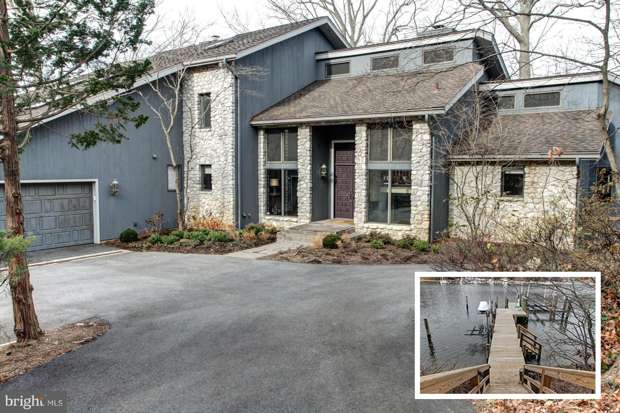 Motivated Seller priced this spacious 6000+ sq.ft WATERFRONT to sell quickly. Over 1 acre of complete privacy! 310' of prime water frontage w/stone retaining walls. Stunning renovations & updates made in past 2 years: new dock w/boat lift & 2 jet ski lifts,  fireplace/patio sitting area, lower level kitchen, FR w/gas fireplace, wine cellar, totally fenced yard, invisible in front...& so much more!