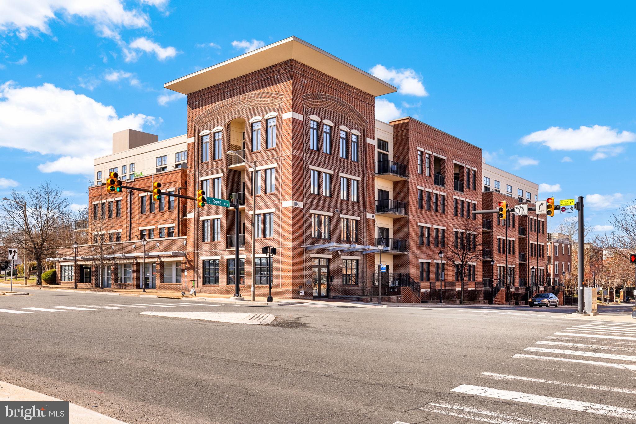 Welcome to Unit 110 at The Preston - a sophisticated 2-bedroom, 2-bathroom condominium offering 1,220 square feet of refined urban living in the heart of Alexandria's vibrant Potomac Yard neighborhood.

The open-concept living and dining area makes an immediate impression, with rich hardwood floors, designer gold-accented light fixtures, and sliding doors opening to a private balcony overlooking the streetscape. The gourmet kitchen is anchored by a generous center island with quartz countertops, warm honey-toned cabinetry, a mosaic tile backsplash, and a full suite of stainless-steel appliances - including a gas range, perfect for the home chef.

Both bedrooms are generously sized with hardwood floors and ceiling fans, while the primary suite features a walk-in closet with custom shelving and an en-suite bath. The second full bath is equally well-appointed, with quartz vanities and tub/shower combinations in both.

Thoughtfully updated throughout: HVAC (3.5 years), water heater (3 years), washer (2025), microwave and range (3 years.) This home is truly move-in ready with nothing left to do but unpack.

Additional highlights include two dedicated parking spaces, a private storage unit, and access to building amenities including a fitness center, rooftop deck, and community room. All of this directly across from Potomac Yard Shopping Center, with easy access to the Potomac Yard Metro, Route 1, and all that Old Town Alexandria has to offer.