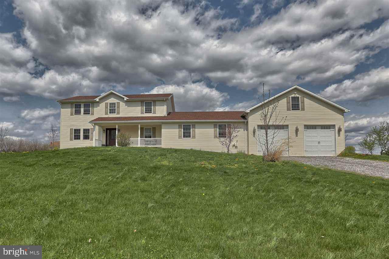 A stunning 5 bedroom, 3 and half bathrooms, country setting home with over 2,800 square feet. This home features TWO master suites, a large eat in kitchen with a formal dining room, a large 2 car garage with Loft above, 3 separate heating zones and huge deck with a hot tub! In 2006 an addition was added along with a new roof, siding, and Brazilian wood work.
