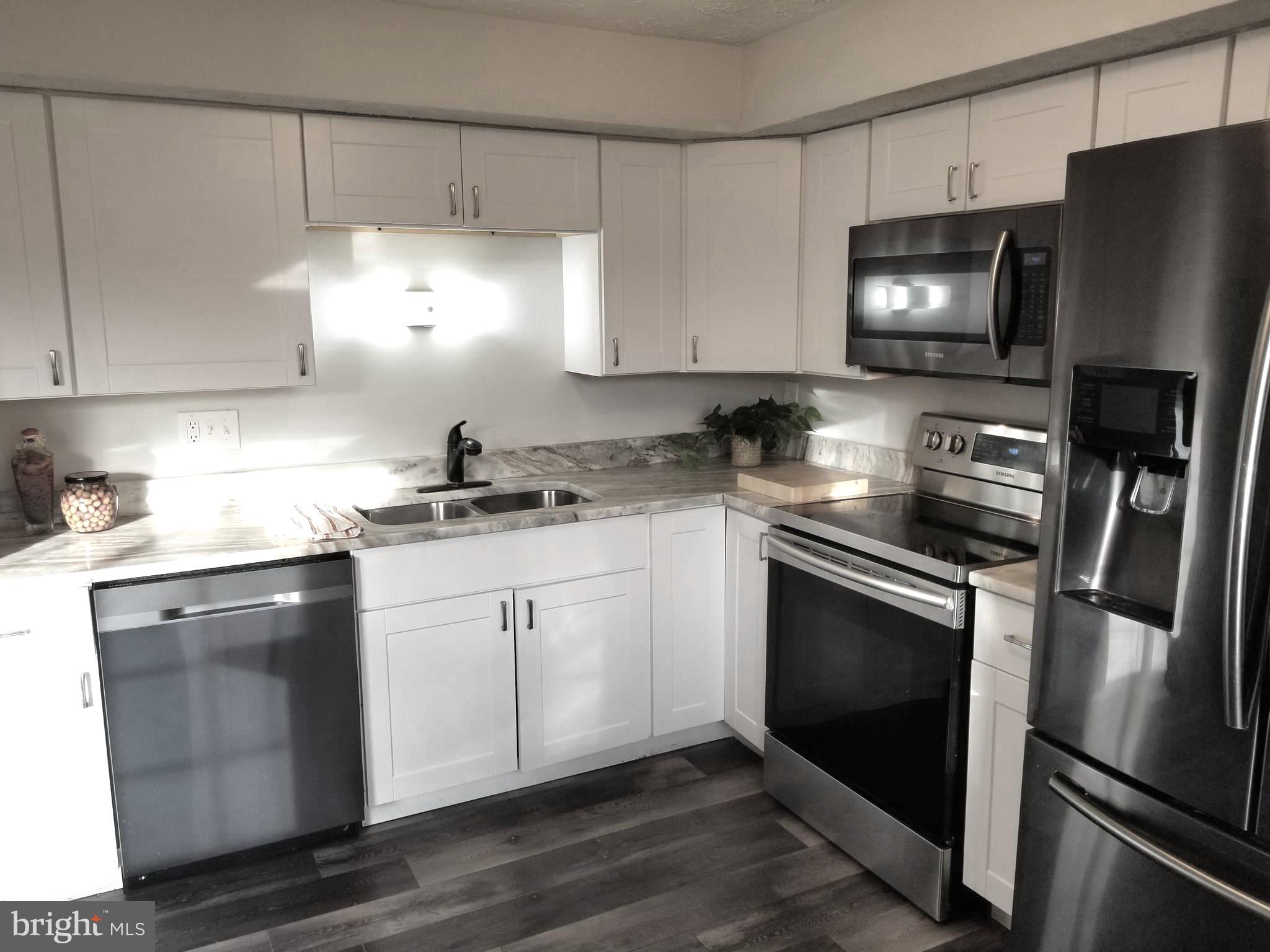 Only 2nd time being rented!*Lovely, remodeled, three-level, roomy townhouse*Rear patio, fully fenced, with gate to common area*Engineered wood floor on main and lower levels; carpeting in bedrooms*Bath on every level:  powder room on main level, powder room on lower level, two full baths on upper level*Two parking spaces directly in front of home (both marked #14)*HOA fee paid by landlord; HOA takes care of front lawn*Tenants take care of front shrubs and all of rear yard inside fence, all utilities*$120,000 combined gross income to qualify (40x monthly rent); $55/adult application fee*No more than 2 incomes to qualify*Sorry, no pets and no smoking.