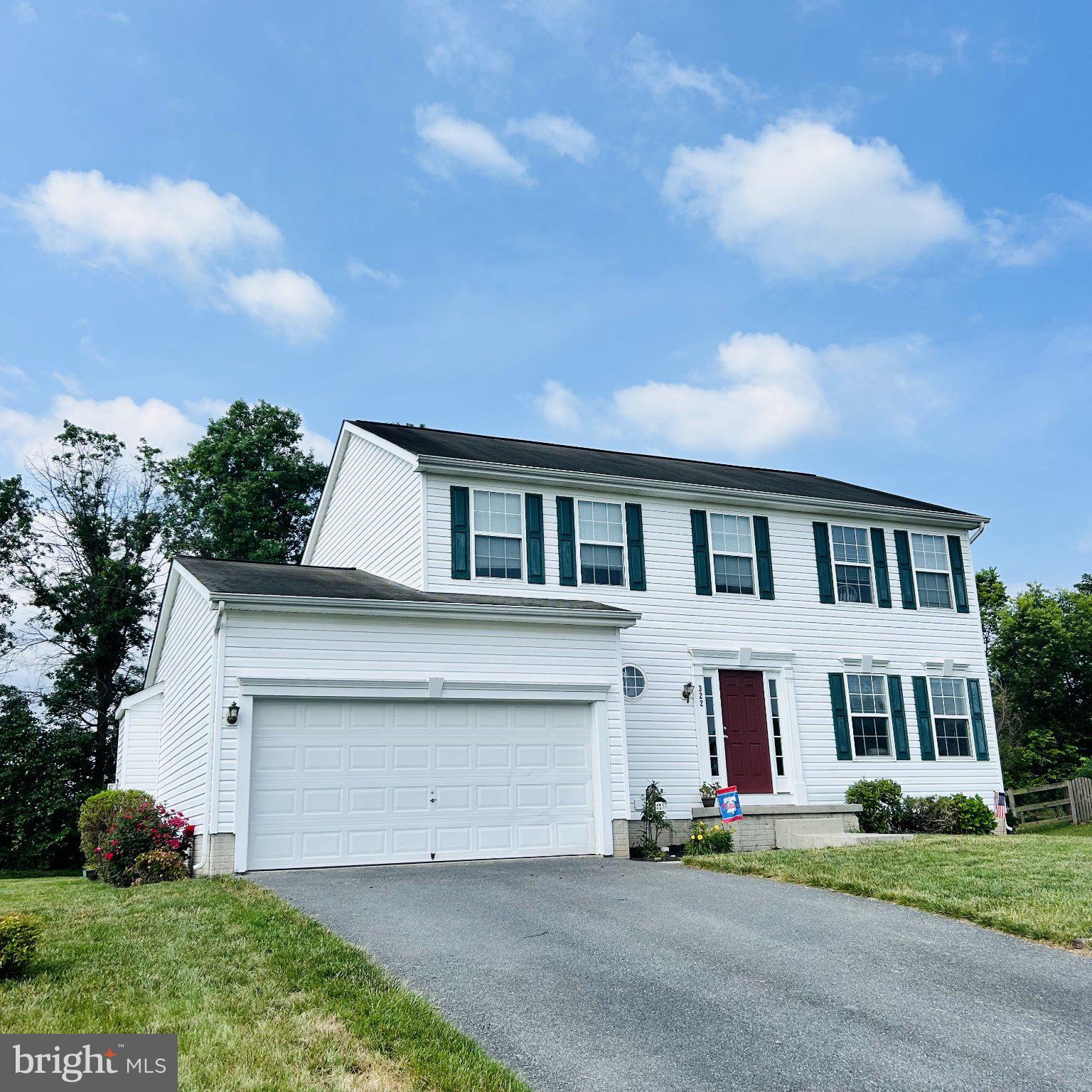 Beautifully maintained 4 bedroom, 3.5 bath home nestled in a desirable small community and backing to a private treelined setting with mountain views. This spacious home features numerous recent updates, including a new refrigerator, stove, dishwasher, disposal, gas water heater, and updated LVP flooring in the kitchen, laundry & half bath. The exterior siding has been thoroughly cleaned.  Both the entry door and basement door have been replaced. The open-concept kitchen and family room with gas fireplace provide an engaging, interactive living space.  The fully finished walk-up basement offers exceptional additional space, complete with a full bath, private office, game room area, and second family room perfect for entertaining, working from home, or accommodating guests. There is storage shelving in the utility room. Radon system installed. Upstairs, you will find 4 generously sized bedrooms with ample closet space.  The primary bedroom has a walk-in closet and full bath with double sink.  All this provides plenty of space for family and visitors alike. Enjoy relaxing or entertaining on the concrete-stamped patio, while taking in the peaceful mountain views. With walk-up basement access, thoughtful updates throughout, and a functional floor plan, this home offers comfort, convenience, and versatility in a wonderful setting. This community is next to a walking nature trail, disc golf, ballfields, tennis courts, community pool, and the best spot in town for the fireworks.  Easy walk to all the downtown restaurants, shops, post office, bank, library, and/or BINGO to support the Vigilant Hose Company.