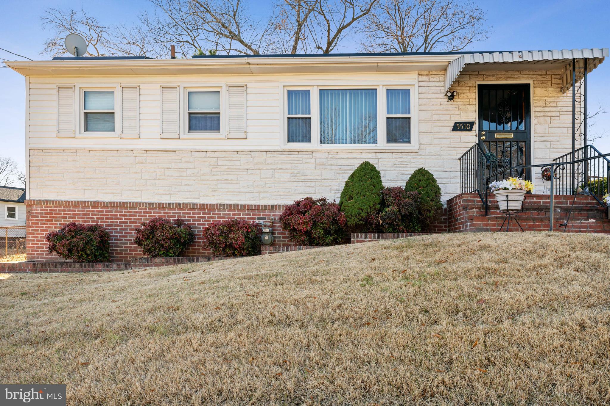 Welcome Home To This COZY Rambler Situated In A Well-Established And Peaceful Neighborhood, Convenient To New Carrollton Metro, Downtown Washington, DC, Local Military Bases And Plenty Of Shopping And Entertainment.  -- MAIN LEVEL -- This Home Boasts * Gleaming Hard Wood Floors Throughout * Ample Sized Bedrooms * A Formal Dining Room For Those Large Gatherings * An Eat-In Kitchen * Ceiling Fans Throughout.*  Additionally,  You'll Love Relaxing And Entertaining In The * Spacious Family Room Located Just Off The Kitchen. * Natural Gas Central Heat * Central A/C* -- LOWER LEVEL -- Has A Finished Rec Room * Making It A Great "Get-Away" Space!  * An Updated Half Bath * Luxury Laminate Plank Floors * Exit Doors To The Outside * Laundry Room With Washer/Dryer * -- EXTERIOR -- The * Expansive Fenced Yard * Is Just Waiting For Kids And Pets To Romp And Play! * Storage shed * Covered Front Porch.*  Come Experience This Home And Enjoy Being Ideally Located To Work, Schools, Entertainment And Shopping!