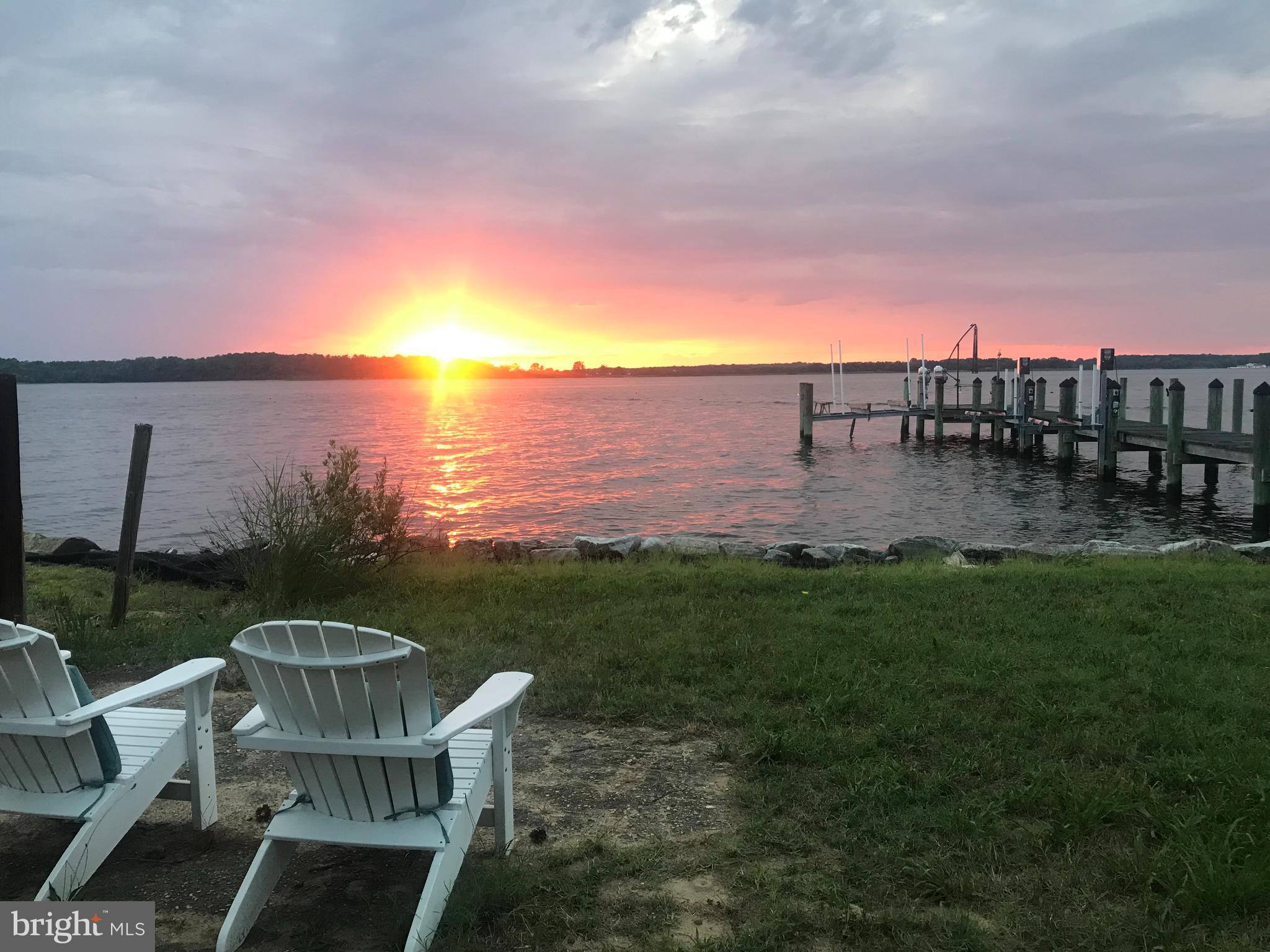 This dreamy waterfront getaway is the perfect spot for you to fully unwind and relax. Located directly along Breton Bay, you'll enjoy peace and serenity while only being a short 10 minute drive from downtown Leonardtown, or take a short boat ride across the bay to Fitzies for drinks and dinner. This charming cape cod offers amazing sunsets whether it's from the scenic deck, screened in porch or the private dock (with boat and jet ski lifts); the views can't be beat! The recently renovated home offers 2 bedrooms and 1 full bathroom, high speed internet, main level washer & dryer and an electric fireplace. The upstairs loft is perfect for an extra sleep area or rec room. Plenty of parking for you and your guests and multiple outbuildings including a detached shed to house all your lawn equipment, outdoor games, you name it! Your piece of happiness awaits!