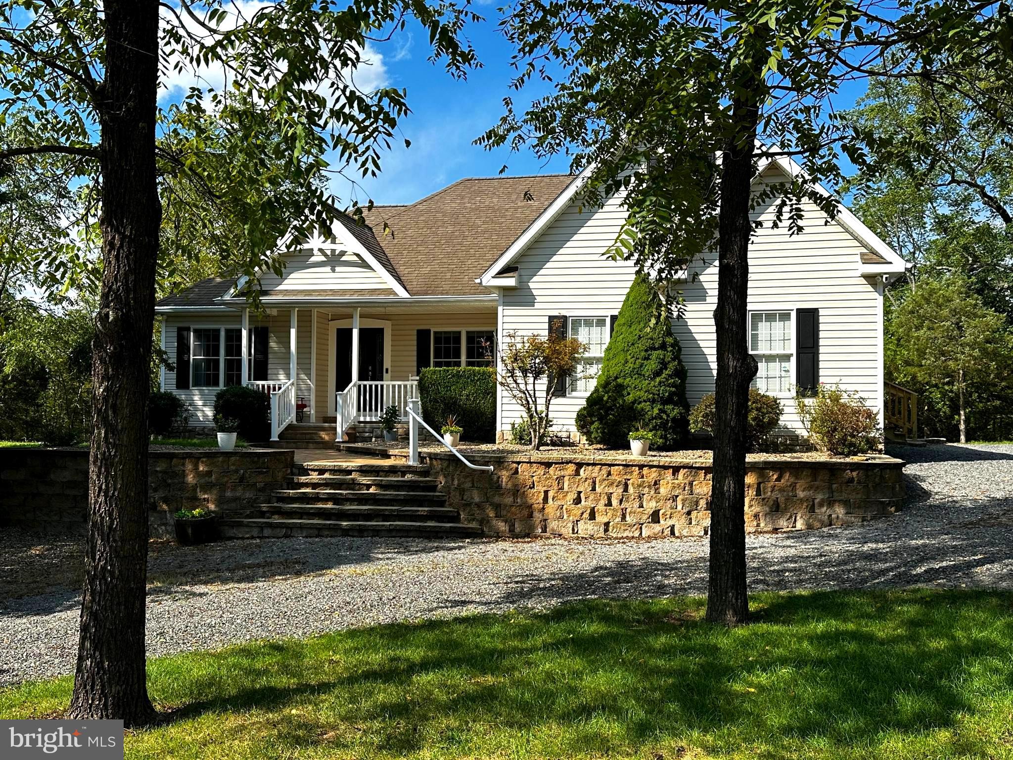 This charming CUSTOM BUILT home is perfect for everyone.  IMMACULATE and MOVE IN READY.  The large family room with vaulted ceilings and cozy gas fireplace is the perfect place to curl up in winter. In summer, you will love the back deck that is a perfect place for summer cook outs and relaxing. Entertain family and friends in this BEAUTIFUL open concept home; with both Eat-in Kitchen and Formal Dining.  Beautiful Granite countertops and stainless steel eye-catching appliances.  Enjoy your evenings in the beautiful Master Bedroom with cathedral ceiling, dual oversized closets and spacious Master Bath with heated tile floors & oversized walk-in shower. The possibilities are endless with an upstairs bonus room and large bright unfinished basement with ground level access. Come see this 3 Bedroom 2 and a half bath home before it's too late. Home is at the end of a no thru street.  A firepit can be found out back for star gazing and enjoy the nights of summer.  Close to all conveniences with the feeling of complete solitude.  Just 5 min from Petersburg, 15 min to Seneca Rocks, 25 min to Moorefield and 10 min to great Trout Fishing.  Take a Virtual Tour by clicking on the camera icon and fall in love with this Move-in Ready Home!
