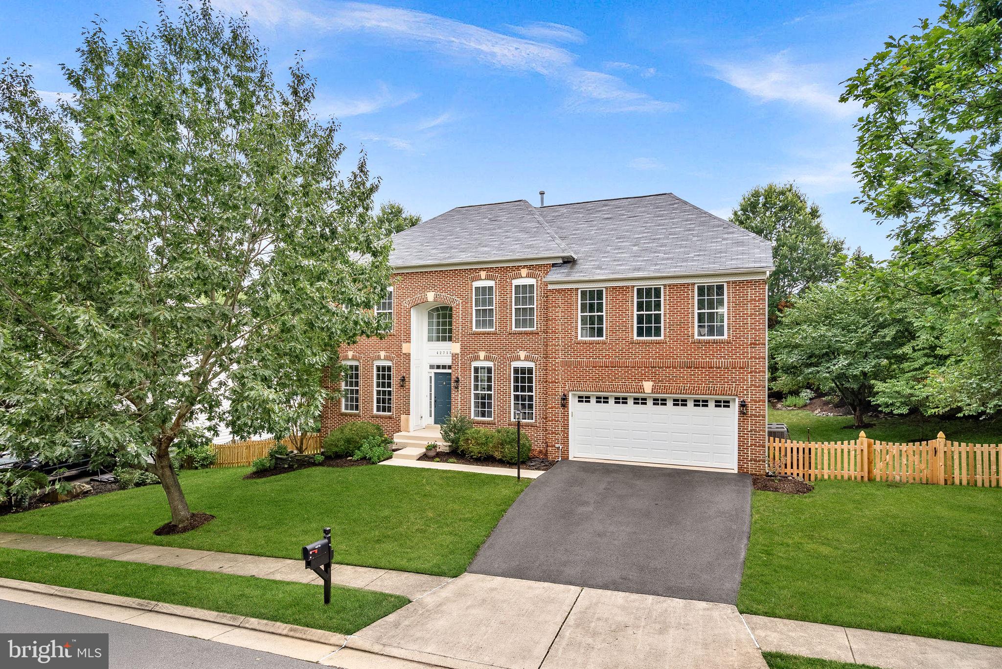 You won't want to miss this beautifully maintained, North-facing home featuring the popular Fitzgerald floor-plan on a premium 1/3 acre lot in the coveted Broadlands neighborhood! Before you even step inside, you can't help but admire the tree-lined views of the culdesac from the front and the back of the home as well as the nicely landscaped yard. Inside, the gleaming solid hardwood floors carry you from the foyer, past the formal living and dining rooms, into the heart of the home. A grand two-story family room features a soaring stone fireplace and opens to the large kitchen, boasting a center island and lots of space for cooking and entertaining. From the kitchen sunroom,  you can easily access the composite deck and fully fenced backyard, perfect for hosting summer cookouts with plenty of room to run around and play.  A dedicated home office on the main level provides privacy and function for working from home.  Upstairs, the Primary Suite is a spacious retreat with custom built ins in the sitting area, a giant walk in closet, and private bath with a separate soaking tub and two vanity areas.  There are 3 more bedrooms and two additional full baths on the upper level.  All new carpet and fresh paint throughout.  The unfinished walk up basement offers the opportunity to build equity by adding an additional 1,500+ sqt ft of living space to suit your needs and already has the rough in for an additional bathroom.  The only limit for how to use the space is your imagination! Zoned for sought after Hillside Elementary, Eagle Ridge Middle, and Briar Woods High Schools.  Enjoy access to Broadland's many wonderful HOA amenities, including 3 pools, miles of walking trails (including one right outside your front door!), playgrounds, tennis, pickle-ball, and basketball courts, and social events. Stroll up the street to Clyde's for dinner or cocktails with friends. Ride your bike to the new Ashburn Rec Center or to beautiful Beaverdam Reservoir Park. Living in the amenity rich and nature filled Broadlands community offers all this, and more! The Ashburn Metro Station, Dulles airport, shopping, dining, and major commuter routes are all just minutes away. Welcome home!