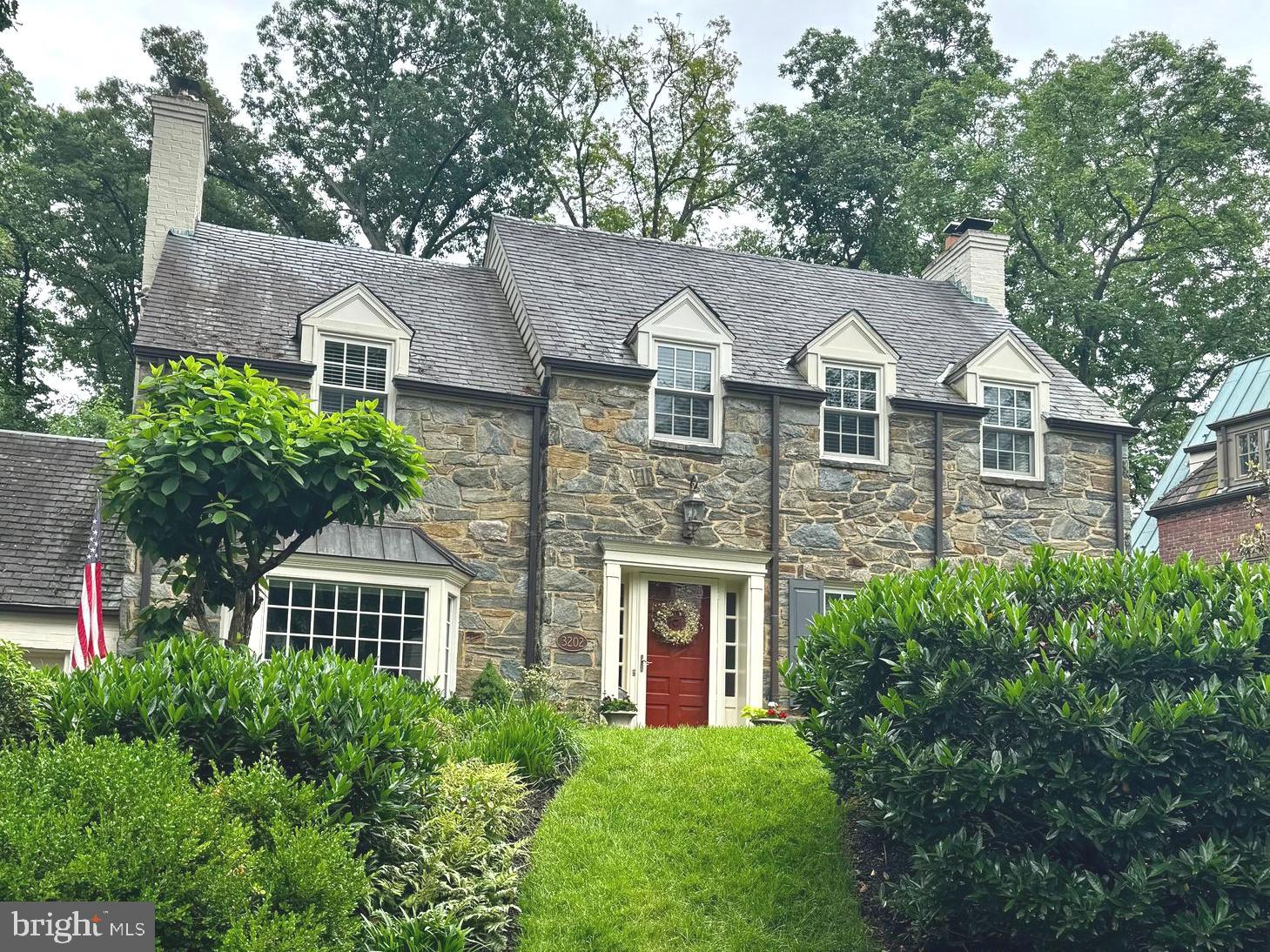 This charming, meticulously cared-for stone and brick colonial is on the market for only the second time in 88 years. Nestled on a quiet street in Chevy Chase’s highly coveted Rollingwood neighborhood, this stately colonial makes a striking first impression. The manicured front yard approach, framed by a pair of beautiful flagstone walkways, welcomes you into an inviting, sophisticated interior.

Inside, the spacious formal living and dining rooms are adorned with rich hardwood floors, elegant wainscoting, and crisp crown molding. The living room features a gas fireplace,  while a butler’s pantry with built-in cabinetry bridges the dining room and kitchen for seamless entertaining.

The heart of the home is the substantial, skylit island kitchen, a chef’s haven complete with heated floors, ample custom cabinetry, premium stainless steel appliances, a sunlit breakfast area, with an adjacent mudroom or prep kitchen featuring a second refrigerator. This culinary hub flows effortlessly into a welcoming family room anchored by a brick wood burning fireplace with a wall of built-in shelving, and also opens to a spectacular ironwood floored screened porch. Both the family room and porch overlook the beautifully landscaped and private rear yard with patio and discreetly hidden bonus storage shed. 

The upper levels offer both refined comfort and future potential. A trio of generously sized bedrooms on the second level features dormered windows that create cozy reading nooks, alongside the clever addition of  an in-wall, pocket-mounted television. Two updated full bathrooms complete this level, while the top-level walk-up attic stands ready for your imagination to create additional potential living space.

The lower level extends the home's versatility, where classic ceramic tile guides you into a second expansive family room centered around its own gas fireplace and custom built-ins. This level also features exercise space, a premium laundry station with top-end appliances, a convenient full bathroom and additional closets . 

Outside, the home’s enduring quality is cemented by a resilient Buckingham slate roof, while the property uniquely includes a portion of the adjacent lot—offering the rare and valuable footprint for potential further expansion.  A separately-metered irrigation system will keep your yard looking its best all summer.

Perfectly positioned, this exceptional residence with attention to architectural detail throughout, is just blocks from the scenic trails of Rock Creek Park, minutes from premier country clubs and two Metro stations, and offers effortless access to the world-class dining, shopping, and entertainment of downtown Bethesda.