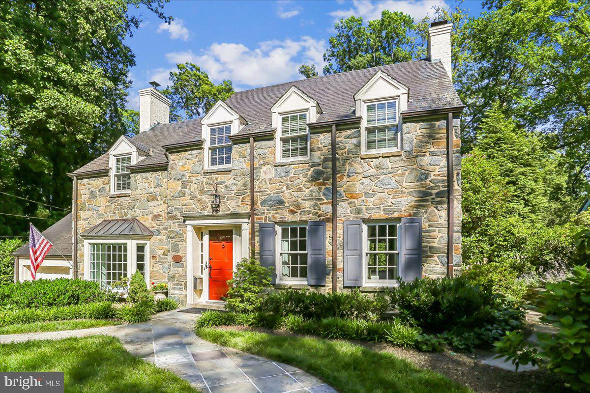 This charming, meticulously cared-for stone and brick colonial is on the market for only the second time in 88 years. Nestled on a quiet street in Chevy Chase’s highly coveted Rollingwood neighborhood, this stately colonial makes a striking first impression. The manicured front yard approach, framed by a pair of beautiful flagstone walkways, welcomes you into an inviting, sophisticated interior.

Inside, the spacious formal living and dining rooms are adorned with rich hardwood floors, elegant wainscoting, and crisp crown molding. The living room features a gas fireplace,  while a butler’s pantry with built-in cabinetry bridges the dining room and kitchen for seamless entertaining.

The heart of the home is the substantial, skylit island kitchen, a chef’s haven complete with heated floors, ample custom cabinetry, premium stainless steel appliances, a sunlit breakfast area, with an adjacent mudroom or prep kitchen featuring a second refrigerator. This culinary hub flows effortlessly into a welcoming family room anchored by a brick wood burning fireplace with a wall of built-in shelving, and also opens to a spectacular ironwood floored screened porch. Both the family room and porch overlook the beautifully landscaped and private rear yard with patio and discreetly hidden bonus storage shed. 

The upper levels offer both refined comfort and future potential. A trio of generously sized bedrooms on the second level features dormered windows that create cozy reading nooks, alongside the clever addition of  an in-wall, pocket-mounted television. Two updated full bathrooms complete this level, while the top-level walk-up attic stands ready for your imagination to create additional potential living space.

The lower level extends the home's versatility, where classic ceramic tile guides you into a second expansive family room centered around its own gas fireplace and custom built-ins. This level also features exercise space, a premium laundry station with top-end appliances, a convenient full bathroom and additional closets . 

Outside, the home’s enduring quality is cemented by a resilient Buckingham slate roof, while the property uniquely includes a portion of the adjacent lot—offering the rare and valuable footprint for potential further expansion.  A separately-metered irrigation system will keep your yard looking its best all summer.

Perfectly positioned, this exceptional residence with attention to architectural detail throughout, is just blocks from the scenic trails of Rock Creek Park, minutes from premier country clubs and two Metro stations, and offers effortless access to the world-class dining, shopping, and entertainment of downtown Bethesda.