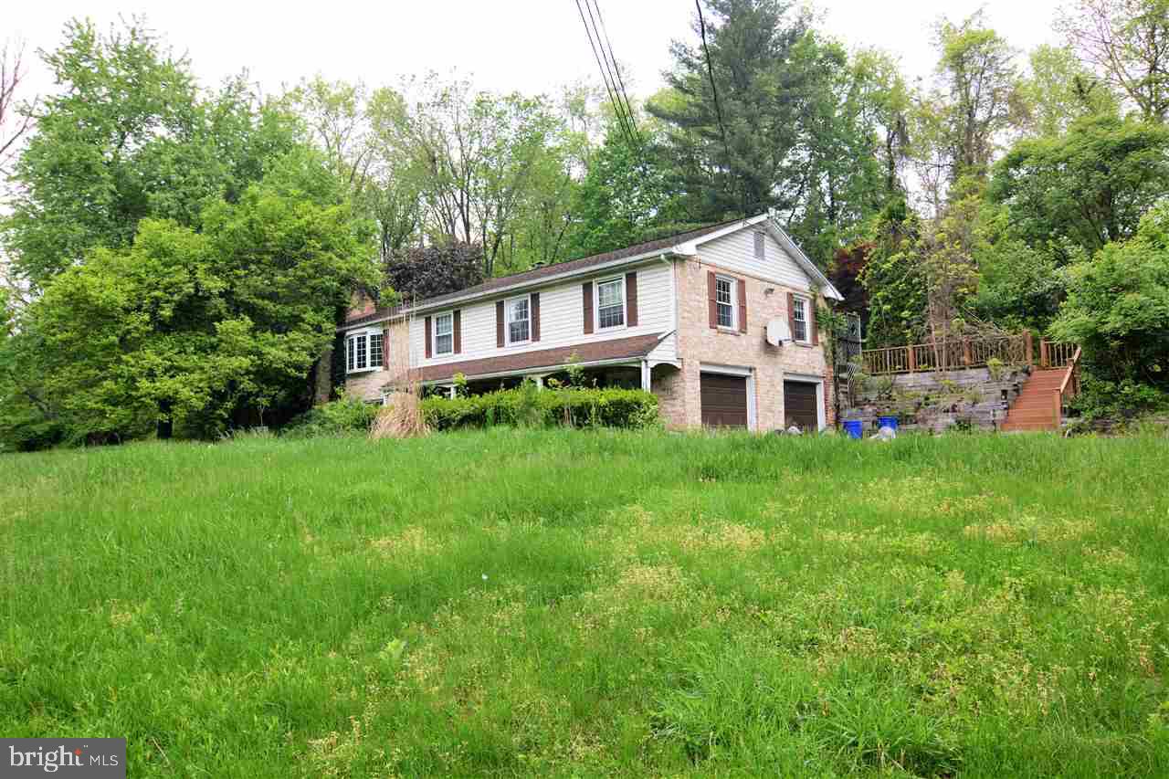 This could be a GREAT home for a family or a GREAT investment!! A little dirty and needs a good cleaning but could be made very beautiful again. 4 bedrooms and 2.5 baths. Wonderful kitchen just need appliances. Sunroom on back with deck going around with hot tub. 4 car workshop with electric and  heat at the end of drive way. Very motivated sellers. Come see!!