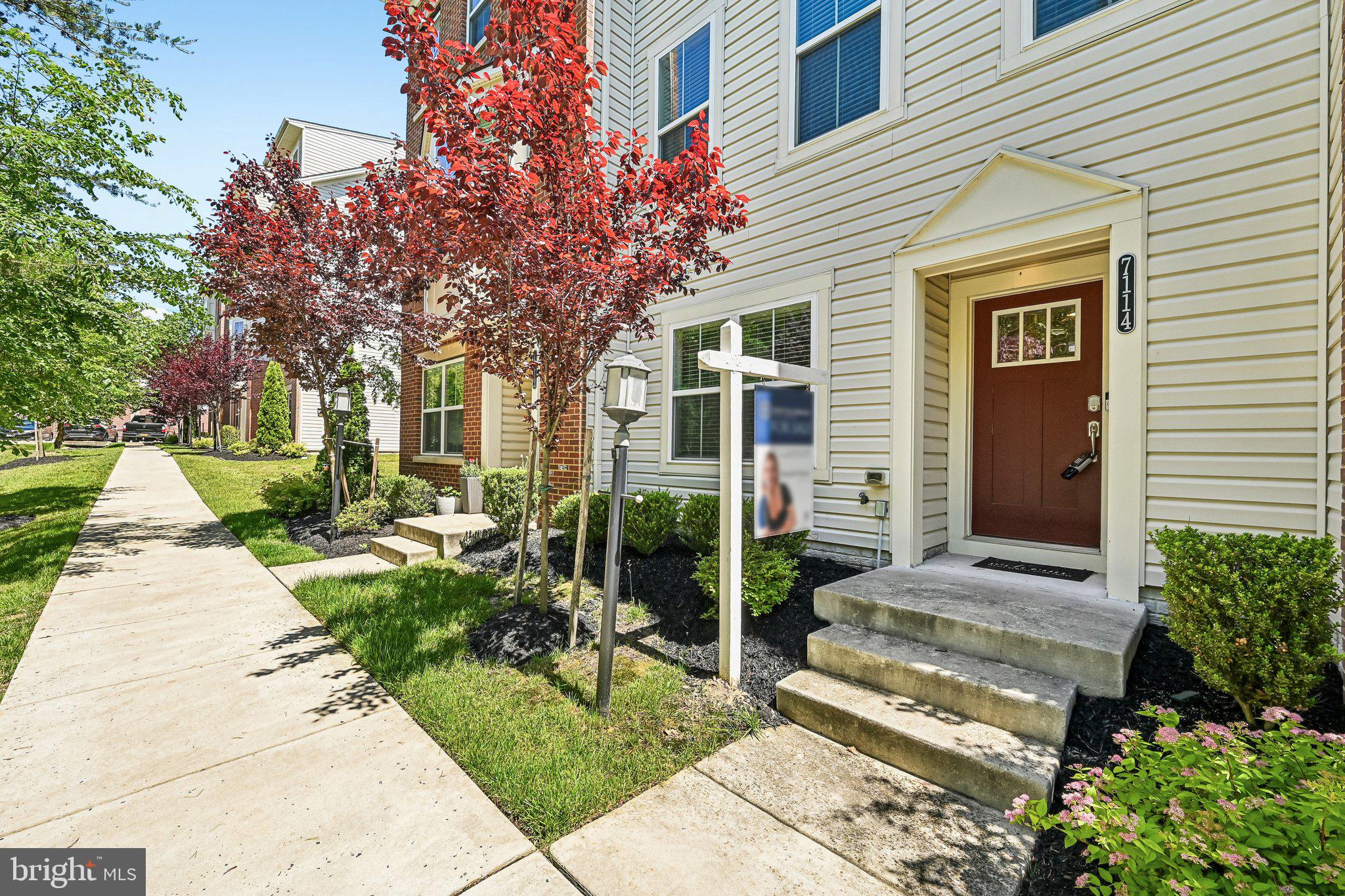 This meticulously maintained townhome in tucked away from the noise, shows like new and is available for immediate occupancy.  Newly installed carpet and custom faux wood blinds throughout!  Main entry bedroom offers a full bath as does each bedroom on the upper level providing privacy for each room.  The gourmet kitchen is where everyone will gather around the expansive granite island and open floorpan to the adjoining family room and eat in breakfast nook.  The maintenance free deck overlooks preserved wooded views.  The moment you arrive in Oxford Square you are indeed in a unique community! Elementary and Middle School access are walkabout within five minutes, as are local retail shops.  Designed for healthy living, the community provides a pool, fitness center, basketball courts and walking paths with a low monthly HOA.  This unique Howard County location makes commuting a breeze, just moments from MD-100, I-95 and nearby shopping.  Welcome Home!