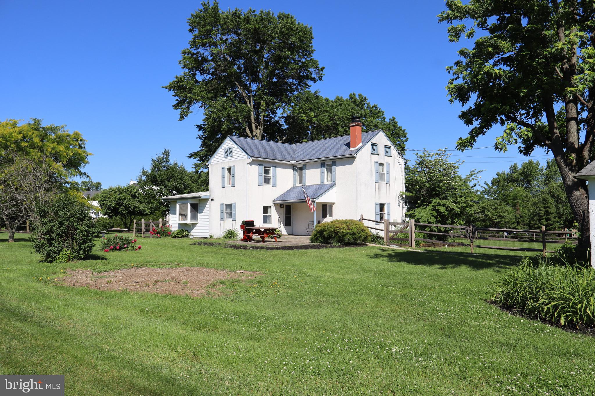 This beautifully maintained Colonial home, built in 1890, offering a perfect blend of classic elegance and modern comfort. Nestled on a generous 0.65-acre lot, this residence boasts 2,466 square feet of living space, providing ample room for relaxation and entertaining. As you enter, you'll be greeted by the warmth of a cozy fireplace, perfect for those chilly evenings. The spacious layout features four inviting bedrooms and one and a half bathrooms, ensuring comfort for everyone. The exterior showcases the expansive yard perfect for outdoor gatherings and leisurely afternoons. With a detached garage and driveway accommodating up to four vehicles, parking is a breeze. Imagine sipping your morning coffee on the porch or hosting summer barbecues in your private backyard oasis. This home is not just a place to live; it's a sanctuary where memories are made. Located in a peaceful setting, this property offers the tranquility of country living while remaining conveniently close to local amenities. Don't miss the opportunity to make this charming Colonial your forever home, where comfort and character come together beautifully. Schedule your private tour today and experience the warmth and charm for yourself!