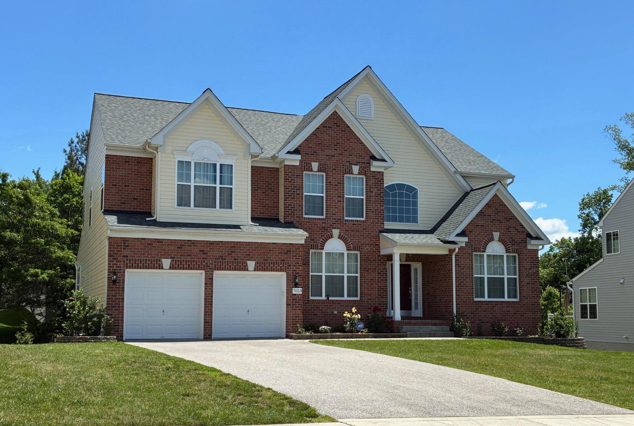 Nestled in the charming community of Samuels Grant, this stunning modern colonial, built in 2017, offers a perfect blend of comfort and elegance. With bump out expansions, this is one of the largest homes in the area, offering over 6500 square feet of finished living space. This residence is designed to accommodate any lifestyle with five spacious bedrooms and three and a half bathrooms,  Step inside to discover an inviting atmosphere, open floor plan, highlighted by a grand two story family room and gas fireplace that serves as the heart of the home. Upgraded hardwoods and tile floors flow throughout the home.  The gourmet kitchen features an oversized quartz counter island, induction cooking, double ovens, plenty of cabinetry and a separate pantry, adjoining an oversized sunroom and deck. The fully finished walkout basement provides an additional living suite with kitchenette, full bath, 5th bonus room/bedroom/study, home theater or playroom. Outside, the level lot offers room for outdoor activities, gardening, or simply enjoying the fresh air. The attached front-entry 2 car garage and ample driveway parking ensure convenience for you and guests. With excellent condition throughout, this home is move-in ready, allowing you to focus on creating memories rather than renovations. A brand new architectural shingle roof installed last week!  Located in a peaceful neighborhood, enjoy the tranquility of suburban living while being just a short drive from local amenities.  Nearby Rt 100, I-95, Rt 295, Baltimore, Washington, BWI, MARC Train, Fort Meade, NSA, JHUAPL, Patapsco State Park, Rockburn Park, and so much more.  This is more than just a house; it's a place where you can truly feel at home. Don't miss the opportunity to make this beautiful property your own.  Schedule your private tour today!
