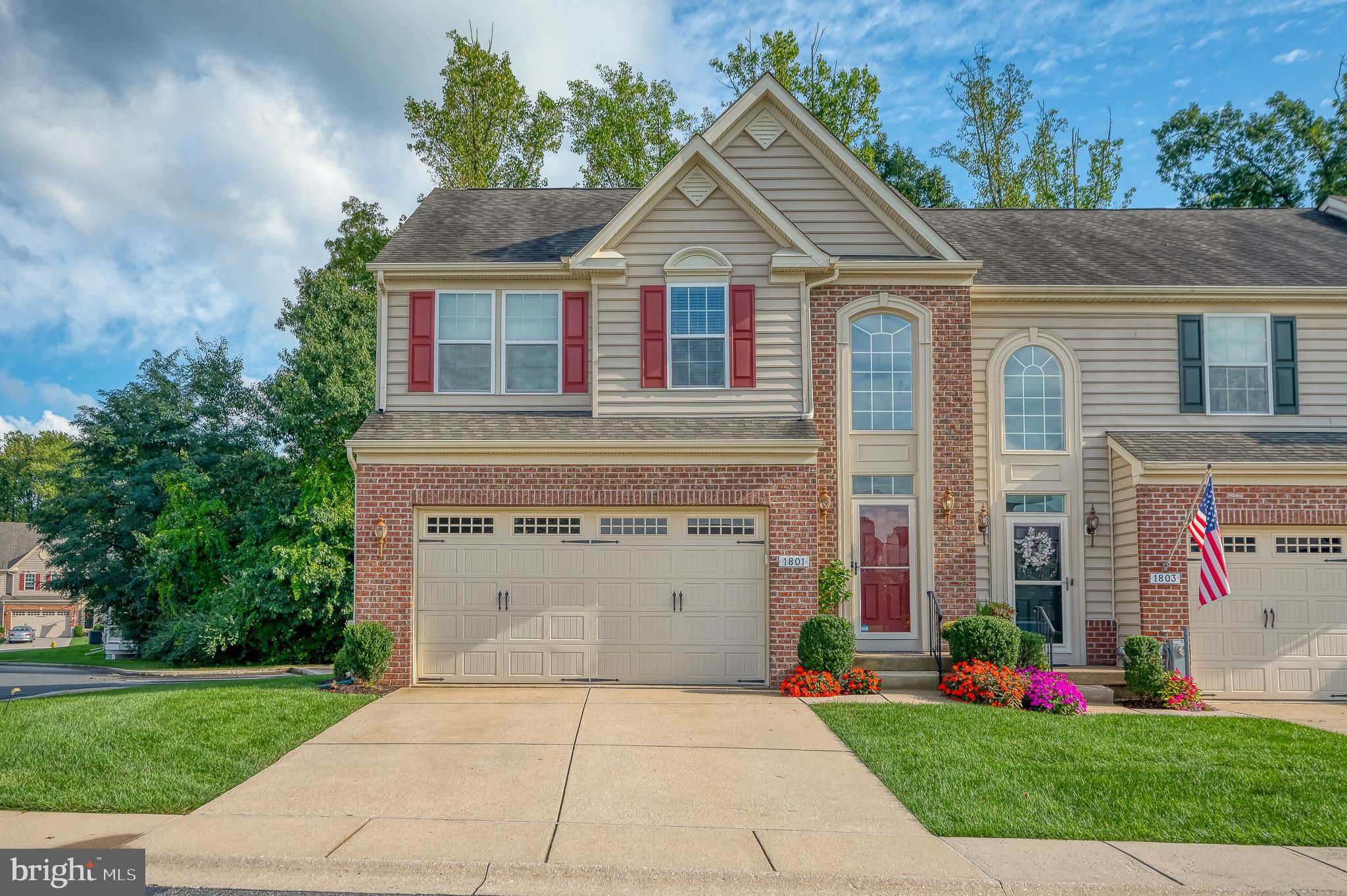 Welcome to 1801 Exton Drive. This end unit villa has bumpouts and extras throughout. Just inside the door, a two-story foyer greets you with beautiful tile flooring and neutral walls. You'll find an eat-in kitchen with 42-inch cabinets, stainless steel appliances, backsplash and bay window. The laundry is situated on the main level for added convenience. The dining room and living room have hardwood flooring and vaulted ceilings - open to the loft above. The sunroom bumpout has a cozy gas fireplace and exit to the relaxing screened porch with walk down stairs to the rear yard. The primary suite has a tray ceiling, walk-in closet and attached primary bathroom. Upstairs,  you'll find two large bedrooms and a full bathroom to share, along with the loft and bonus room - ideal for an office or craft room. The lower level is also finished with a family room, bathroom, office/bonus room and unique built-in bar area, along with a workshop. This home is sure to impress! There is plenty of extra parking and it's an easy walk to the clubhouse.