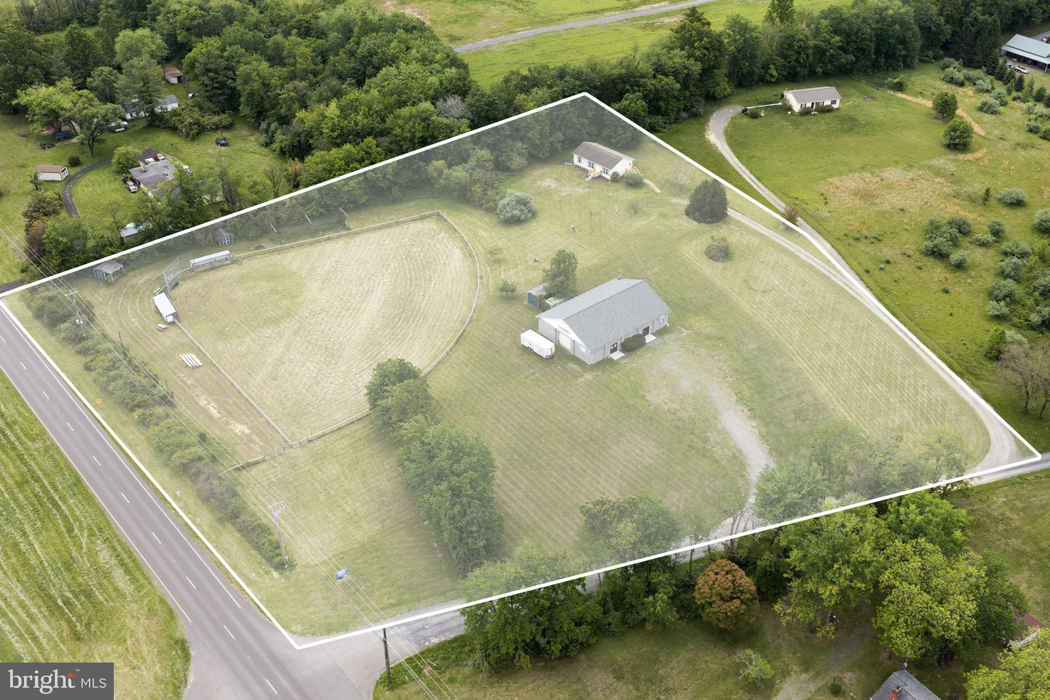 Field of Dreams offers a rare opportunity to own a truly unique 5-acre property along highly visible Route 211 in Virginia’s scenic countryside of Rappahannock County. Formerly known as the iconic Bill Payne Auction Gallery and most recently utilized as a worship center, this versatile RR-5 zoned property features three standout components: a beautifully renovated home, an expansive work/event space, and the nostalgic former ballfield that made this property a local landmark.

The newly-renovated residence offers 3 bedrooms and 2 baths with fresh modern updates throughout including new appliances, LTV flooring, carpet, and an unfinished walkout basement ready for future expansion or storage.

The former auction gallery  pans over square 3,500 square feet and offers exceptional flexibility with a kitchen, office areas, studio space, storage rooms, and endless possibilities for business, creative, or community use. Large commercial sectional overhead door for equipment, storage, or warehouse access. The property also carries exciting potential for income-producing opportunities. 

For those dreaming of reviving the legendary ballfield special exception permits would need to be pursued through the county. Whether your vision is recreation, events, business, or investment, the groundwork for something extraordinary is already here.

Conveniently located near vineyards, breweries, and Shenandoah National Park, the property is just 15 minutes to Warrenton and one hour to Washington, D.C. High Speed Internet Available.
