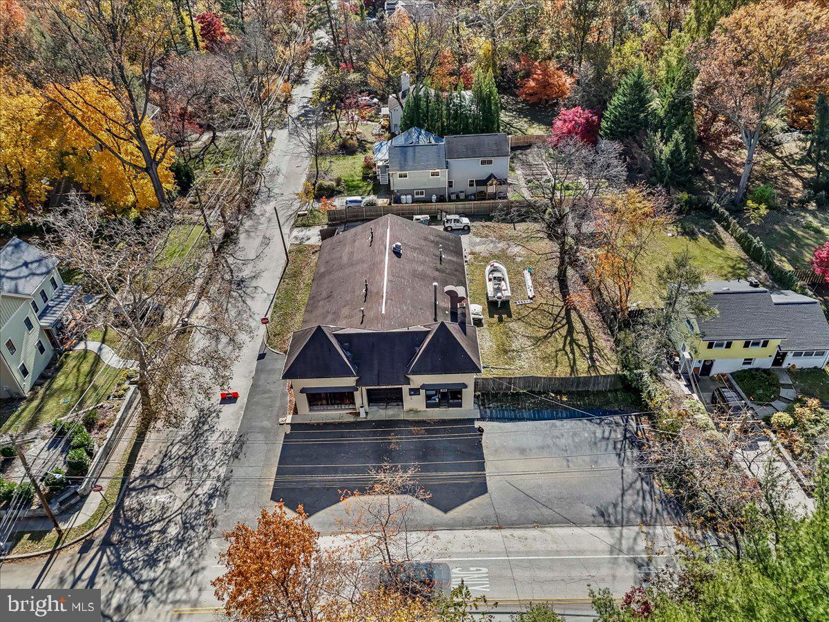 Do not miss this rare opportunity to build up to 8 residential dwelling units situated within 2 blocks of the train, town and Swarthmore College.    This flat corner lot of 15000 sq ft was just approved for residential use by the  Borough of Swarthmore.  Property is now commercial use and can remain so with 5000 sq ft of enclosed building space and ample parking for cars or trucks.  Steel  beam construction with elevated ceilings,  double and single garage door openings, office and powder room.  The second floor has a powder room and 2 additional rooms.  Small Basement area. Fenced in property has rear access from Rutgers Avenue.  Conveniently  located near major roads, medical facilities and shopping.