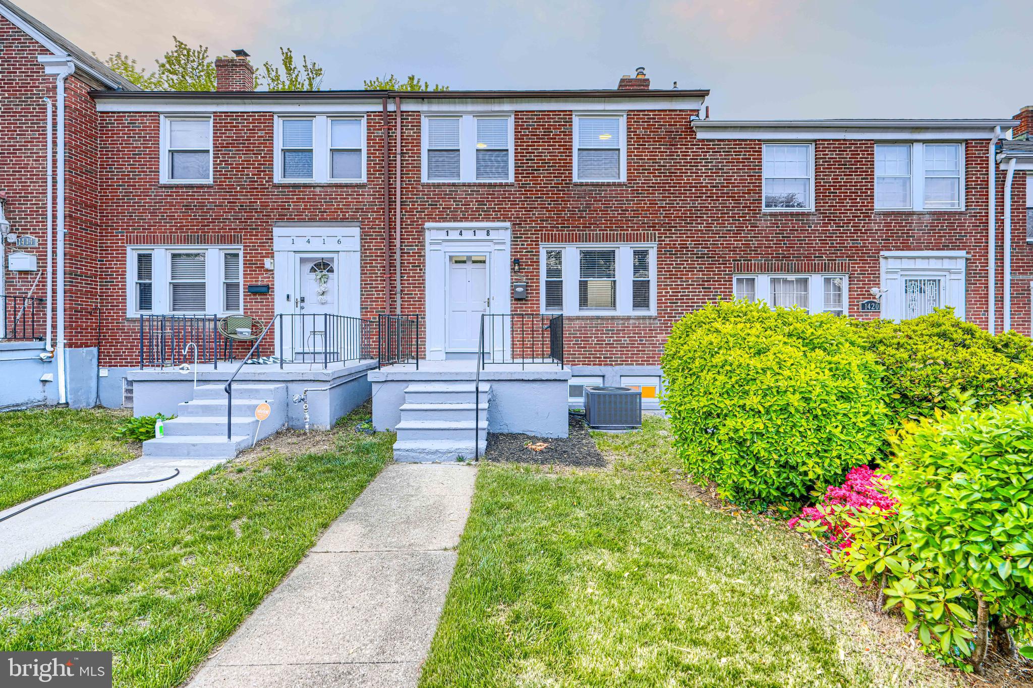 Welcome to 1418 N Forest Park Avenue, a fully renovated interior brick rowhome offering four bedrooms, two full baths, and one half bath. The main level features beautifully refinished hardwood floors  a fresh neutral color palette and a unique layout with a front family room and a rear primary suite complete with an updated en-suite bathroom showcasing new tile surround and modern fixtures. Upstairs, you’ll find three additional bedrooms, continuing  hardwood flooring, ample closet space and sharing another  fully renovated full bath. The lower level includes a front utility and laundry area with a convenient half bath, while the rear of the basement features a brand-new kitchen with modern white cabinetry, quartz countertops, stainless steel appliances, brushed nickel accents, a deep single deep sink, and a separate dining space. Major upgrades include a new roof, new windows, and fresh landscaping. A turnkey property offering space, flexibility, and modern finishes—schedule your showing today!