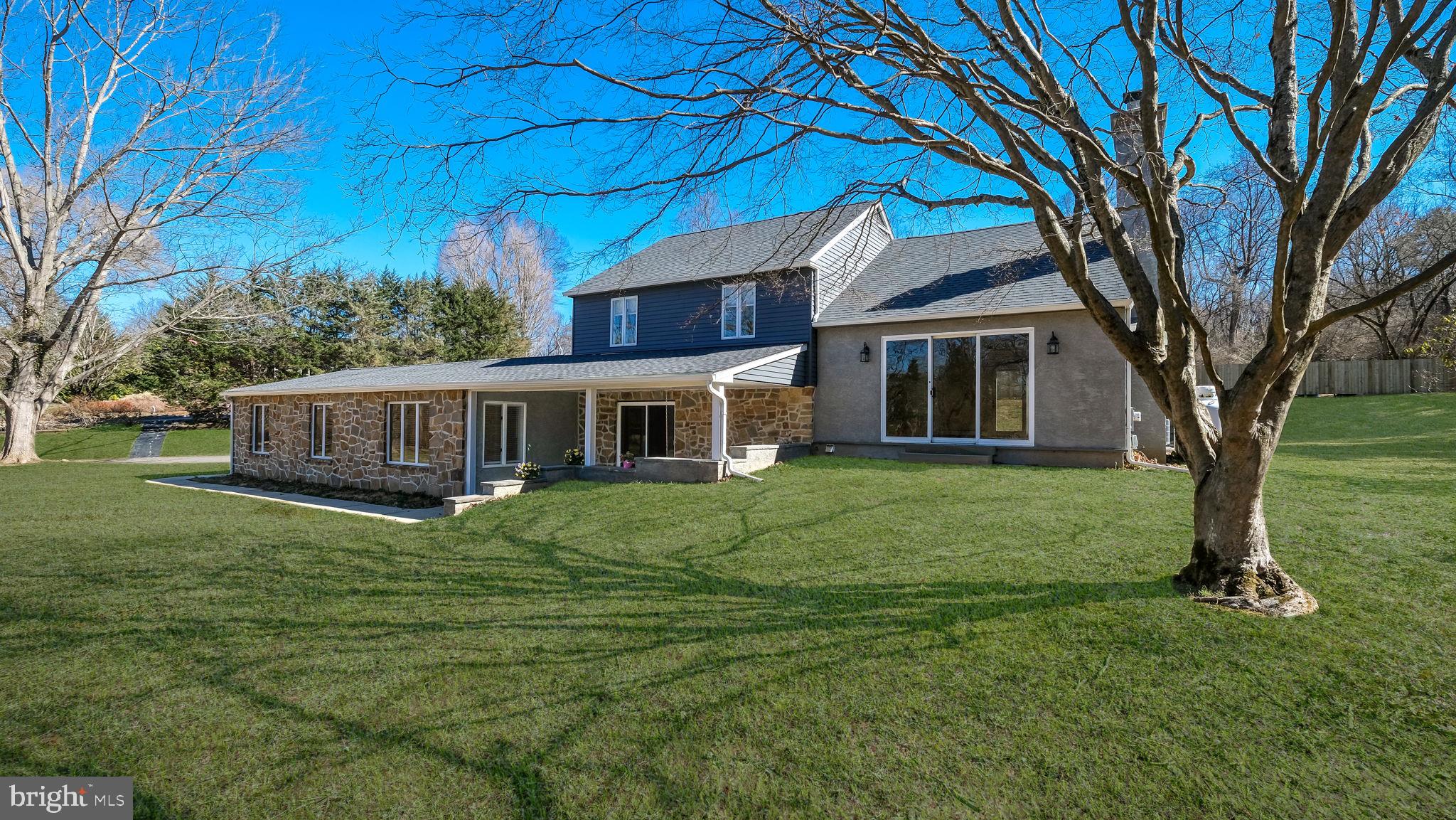 Stunning, pristine and fully renovated split-level home with 3 bedroom 2 full bathrooms in the Tanguy community, Thornbury Township with West Chester Schools. This is a luxuriously appointed, sunlit home you have to see to appreciate its exquisite finishes, unique features and flexible spaces.  The large open-concept main level has radiant-heated floors to keep your feet warm all winter long. This level encompasses a stunning eat-in kitchen with granite countertops, tile backsplash and all-new stainless-steel appliances. There is plenty of space for a large breakfast area under the lovely bay window, as well as an additional foyer or dining area beyond the breakfast bar, and a spacious family room between the kitchen and the garage. Also on this level is an elegant full bathroom with a stone-tile floor and a large marble and glass shower with river stone floor.  From the kitchen in the heart of the home, a window over the sink looks out to the grassy backyard,  while on the front side of the home, sliding doors open onto a covered front patio (bench swing included!) which overlooks the large front lawn, and across the quiet street, the community playground, pond and open space.   From the main level, up one half-flight of extra wide stairs, you will find the large living room, with a decorative stone fireplace and mantle, and built-in bookcases. This bright, beautiful room has a huge custom sliding door with an extra glass panel, leading out the front of the house down stone steps, Across the room, another slider opens onto the rear patio.   Up one more half-flight of stairs you will be find the bedrooms and an even more luxurious bathroom, this one with dual sinks, another stunning marble and glass shower, and a large mirror with integral soft-touch light around the frame.  The primary bedroom features a wall of deep closets which extend back under the eaves.  All three bedrooms on this level have ample closet space and low-profile over-head lighted ceiling fans. But beyond these three rooms, there is an additional large room upstairs, sunlit by large skylights in the sloped ceiling. This space might serve as a children's bedroom, play room, gaming room or your own private relaxing or creative space.  Add to all these inside spaces a huge 2 car attached garage with inside access and automatic overhead doors,  driveway parking for plenty more cars, front and rear patios, rear privacy fence, mature trees and hardscaping. This unique home is set in an idyllic environment with greenery on display outside every window and bountiful open space to enjoy, yet all close to major roads, schools, shopping and amenities. New washer and dryer are in the basement, along with the new water treatment system. All-new systems, window treatments and immaculate fresh paint throughout the home.  This is one you have to see!