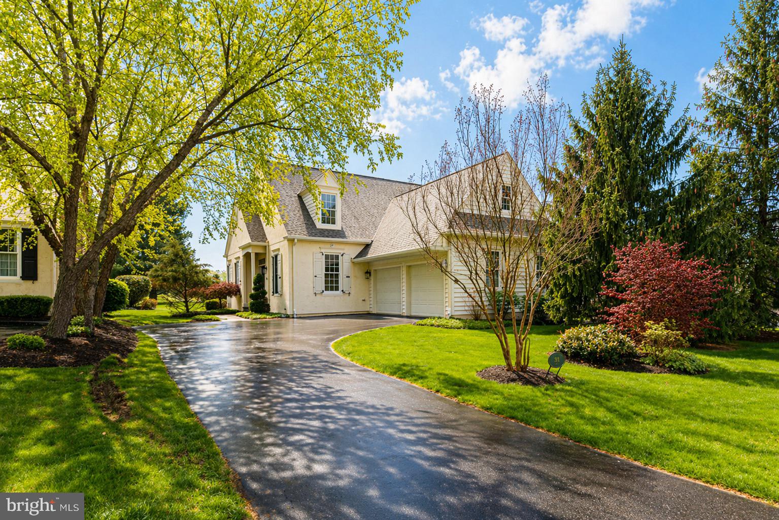 MAJOR PRICE IMPROVEMENT! Welcome to 371 Applebrook Drive in Malvern, a beautifully appointed Pohlig-built “Dursley” model carriage home set along the 18th fairway of Applebrook Golf Club. Offering a sophisticated, low-maintenance lifestyle, this home combines elegant design, thoughtful updates, and inviting indoor and outdoor living space. The main level features hardwood floors throughout, extensive custom millwork, crown moldings, chair railings, and designer details. A gracious formal dining room sets the stage for entertaining, while the spacious family room offers a gas fireplace, a wall of custom built-ins, abundant storage, and stunning golf course views through oversized windows. The gourmet kitchen is designed for both style and function, featuring large tile flooring, granite countertops, a large center island, tile backsplash, and pendant lighting. Just beyond, the breakfast room with vaulted ceiling provides a bright and welcoming space for casual dining. The main-level primary suite offers comfort and convenience, complete with a luxurious bath featuring separate vanities and a soaking tub. Also on the first floor is a handsome office/den with a built-in bar, ideal for working from home or relaxing, as well as a powder room. Upstairs, two additional bedrooms with plush carpeting share a bathroom. The mostly finished lower level expands the living space with a huge recreation room and den, offering flexibility for a media room, gym, home office, or hobby space. Outside, enjoy a landscaped yard and a beautiful patio with sitting wall, perfect for taking in the serene setting. Additional highlights include a two-car garage and a prime location with convenient access to the premier private Applebrook Golf Club, 55 acres of an active community space East Goshen Park and the shopping and dining of a walkable, village -style downtown Malvern. Located only 25-30 miles west of Philadelphia, with easy access to SEPTA Paoli line and close to desirable towns like West Chester, Paoli and King of Prussia.