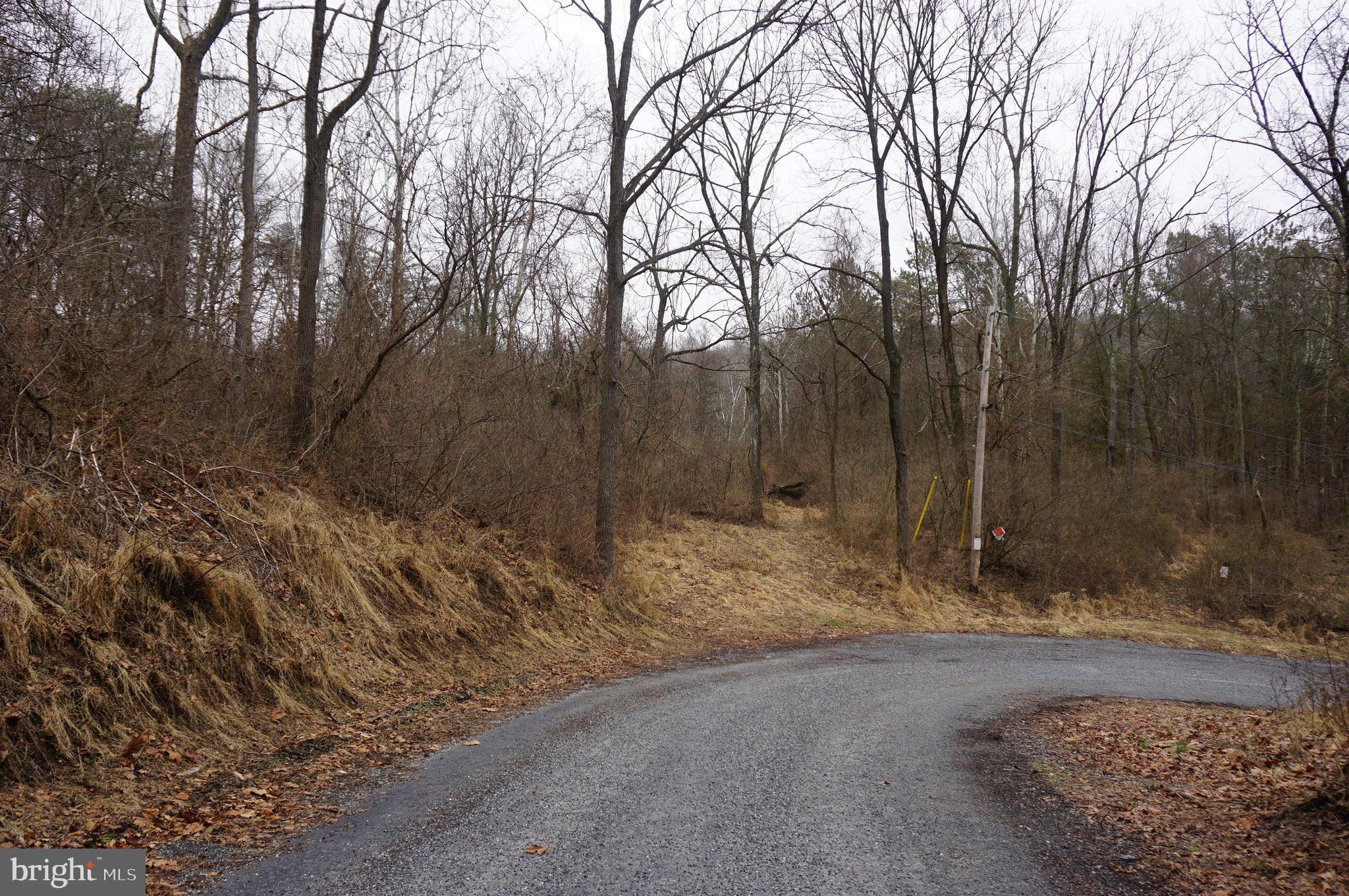 8.3 Wooded Acres with frontage along Muddy Creek. A great place for your new home or an awesome get away! Perc approved and well that was drilled many years ago on property.