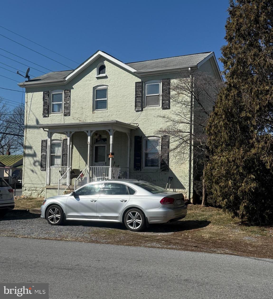 This large, two-level brick home located in the heart of Ranson, WV, offers a fantastic opportunity for both remodelers and homeowners interested in house hacking. The house is currently configured as a duplex, with one unit is currently rented, but the home could be easily returned to its original single family configuration by opening back up the central staircase.  Each spacious unit features two bedrooms and one bathroom, making this property ideal for generating rental income or serving as a live-in investment. The upstairs kitchen has been removed for remodeling which might streamline its conversion back to a single family home.