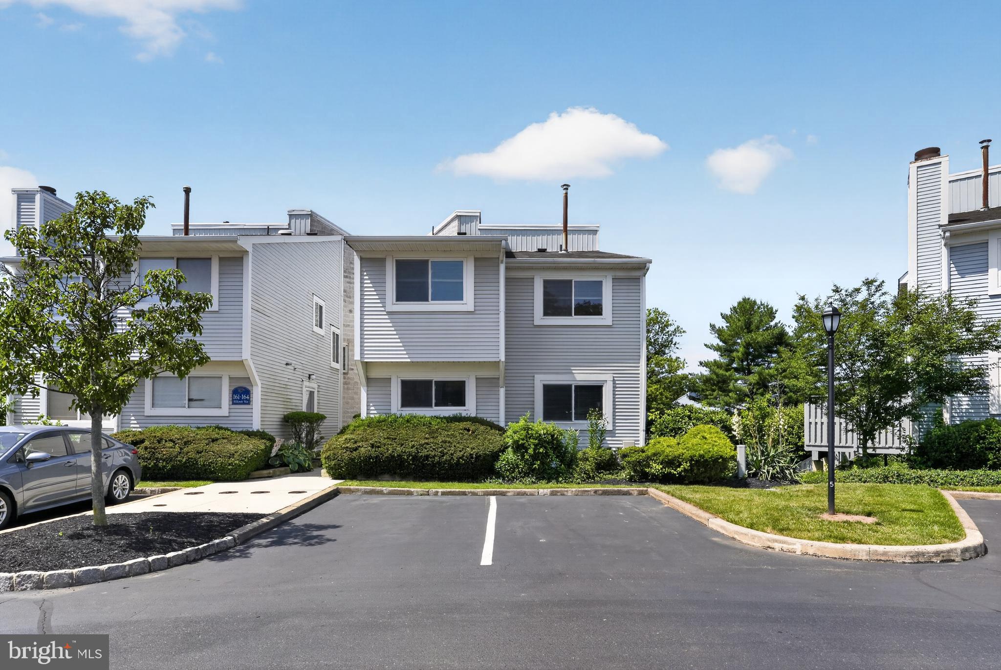 Welcome to 163 Hillcroft Way, a beautifully maintained contemporary townhome in the highly sought-after Eagle Ridge community of Newtown, Bucks County. This move-in ready 2-bedroom, 2-bath home offers 1,340 square feet of bright, comfortable living space, plus a professionally finished lower level, all within the award-winning Council Rock School District.

The main level features an open-concept layout with durable laminate and engineered hardwood flooring throughout the spacious living and dining areas. The eat-in kitchen offers extensive hardwood cabinetry, generous counter space, a large pantry, and a sunny breakfast nook. Upstairs, two oversized bedrooms feature plush carpeting and custom built-in closet systems for exceptional storage and organization.

The finished lower level adds approximately 600 square feet of versatile living space—perfect for a family room, home office, or media area—with additional built-in storage throughout. Energy-efficient double-pane windows and an updated central HVAC system provide year-round comfort and efficiency.

Enjoy outdoor living on the private rear patio and renovated deck, ideal for relaxing or entertaining. The Eagle Ridge HOA includes lawn care, snow removal, trash service, common area maintenance, and access to the community pool for easy, low-maintenance living.

Conveniently located just minutes from historic downtown Newtown, shopping, dining, major commuter routes, and Tyler State Park, this home offers the perfect combination of comfort, convenience, and community.