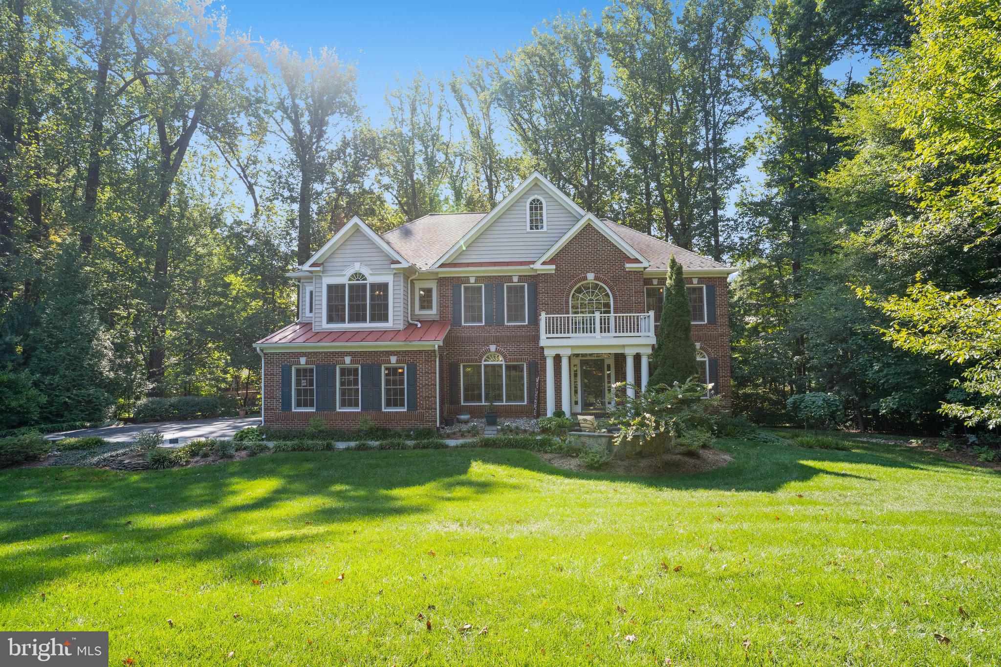 BEAUTIFUL - inside and out, and as you look through the pictures, you will see what I mean.  An open floor plan on the main level allows flow from the kitchen to sunroom to family room to 3 season screened-in porch to the library/den/office. * The dual split staircase takes you to the upper level where you have the large primary suite and sitting area, 3 additional bedrooms, 3 full baths, and a "you have never seen anything quite like it" laundry room.  * The lower level is spacious with a large rec room, 5th bedroom, full bath, an extra room for hobbies or exercise equipment, a large unfinished storage area, and a walkout to the lovely backyard and patio. If needed, this space could be used for extended family or a live-in nanny.  *  There is a 3 car side load garage for vehicles and "toys." *  The acre plus lot, with many pretty trees, bushes and plantings is private and set back from the road, yet convenient to major transportation routes, shopping and restaurants. * Fair Oaks Mall, Fair Lakes, Fairfax Corner, Fairfax Town Center, and the Fairfax County Government Center are close by.  Even Wegman's! *  Come see in person and be impressed! Check out the pictures to see this home in all seasons.